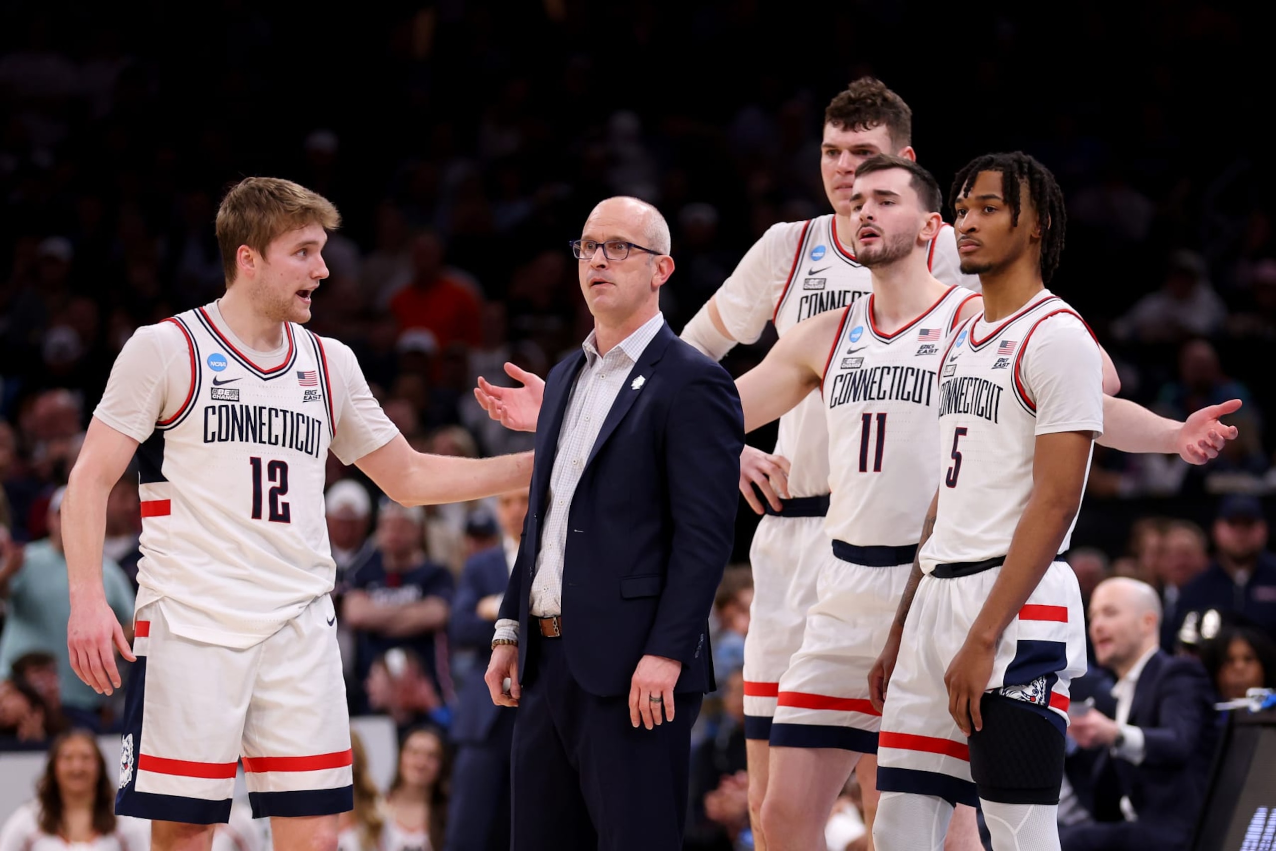 BOSTON, MASSACHUSETTS - MARCH 30: Cam Spencer #12 and head coach Dan Hurley of the Connecticut Huskies react against the Illinois Fighting Illini during the second half in the Elite 8 round of the NCAA Men's Basketball Tournament at TD Garden on March 30, 2024 in Boston, Massachusetts. (Photo by Michael Reaves/Getty Images)