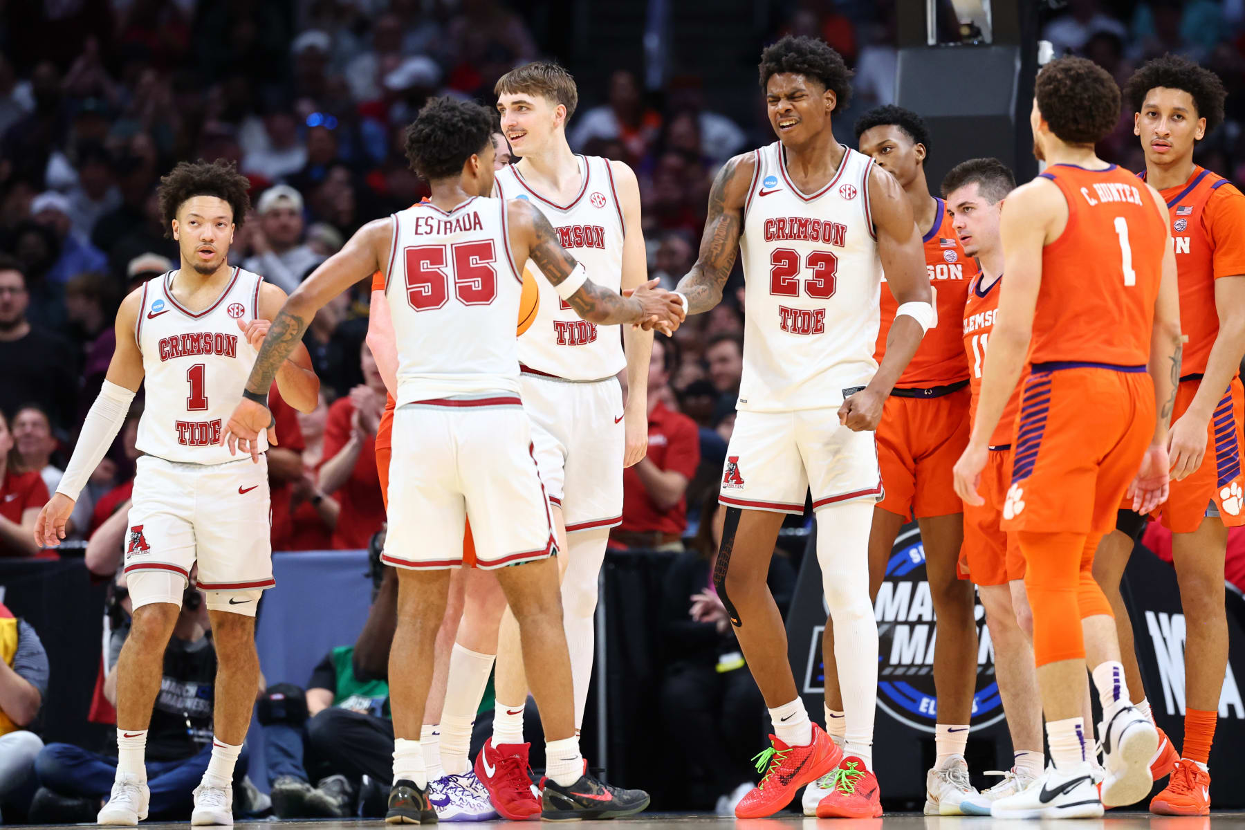 LOS ANGELES, CALIFORNIA - MARCH 30: Nick Pringle #23 of the Alabama Crimson Tide celebrates with Aaron Estrada #55 of the Alabama Crimson Tide during the Elite Eight round of the 2024 NCAA Men's Basketball Tournament held at Crypto.com Arena on March 30, 2024 in Los Angeles, California. (Photo by C. Morgan Engel/NCAA Photos via Getty Images)