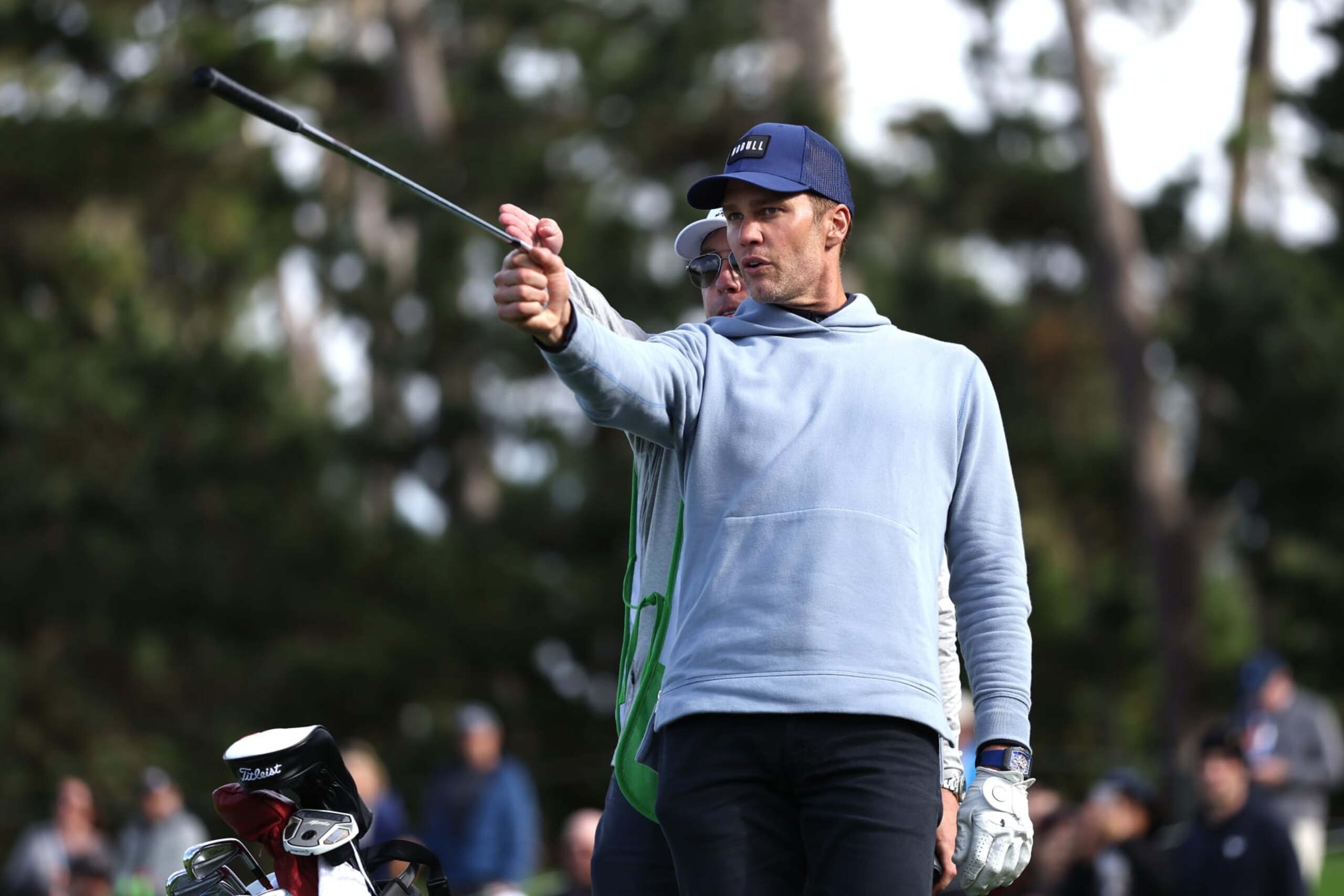 PEBBLE BEACH, CALIFORNIA - FEBRUARY 01: Former NFL quarterback Tom Brady prepares to play a shot on the first hole during the first round of the AT&T Pebble Beach Pro-Am at Pebble Beach Golf Links on February 01, 2024 in Pebble Beach, California. (Photo by Christian Petersen/Getty Images)
