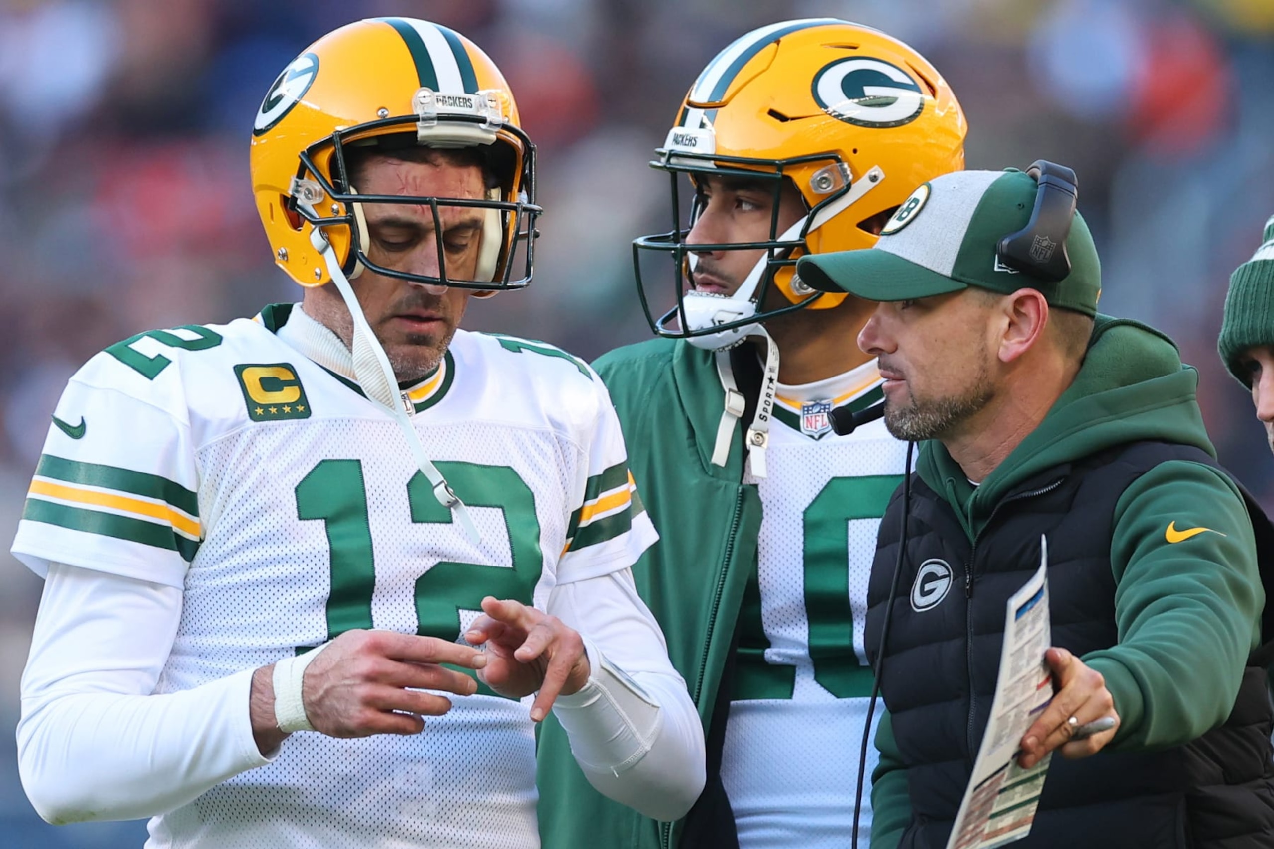 CHICAGO, ILLINOIS - DECEMBER 04: Aaron Rodgers #12, Jordan Love #10 and head coach Matt LaFleur of the Green Bay Packers look on during the fourth quarter of the game against the Chicago Bears at Soldier Field on December 04, 2022 in Chicago, Illinois. (Photo by Michael Reaves/Getty Images) CHICAGO, ILLINOIS - DECEMBER 04: Aaron Rodgers #12, Jordan Love #10 and head coach Matt LaFleur of the Green Bay Packers look on during the fourth quarter of the game against the Chicago Bears at Soldier Field on December 04, 2022 in Chicago, Illinois. (Photo by Michael Reaves/Getty Images)