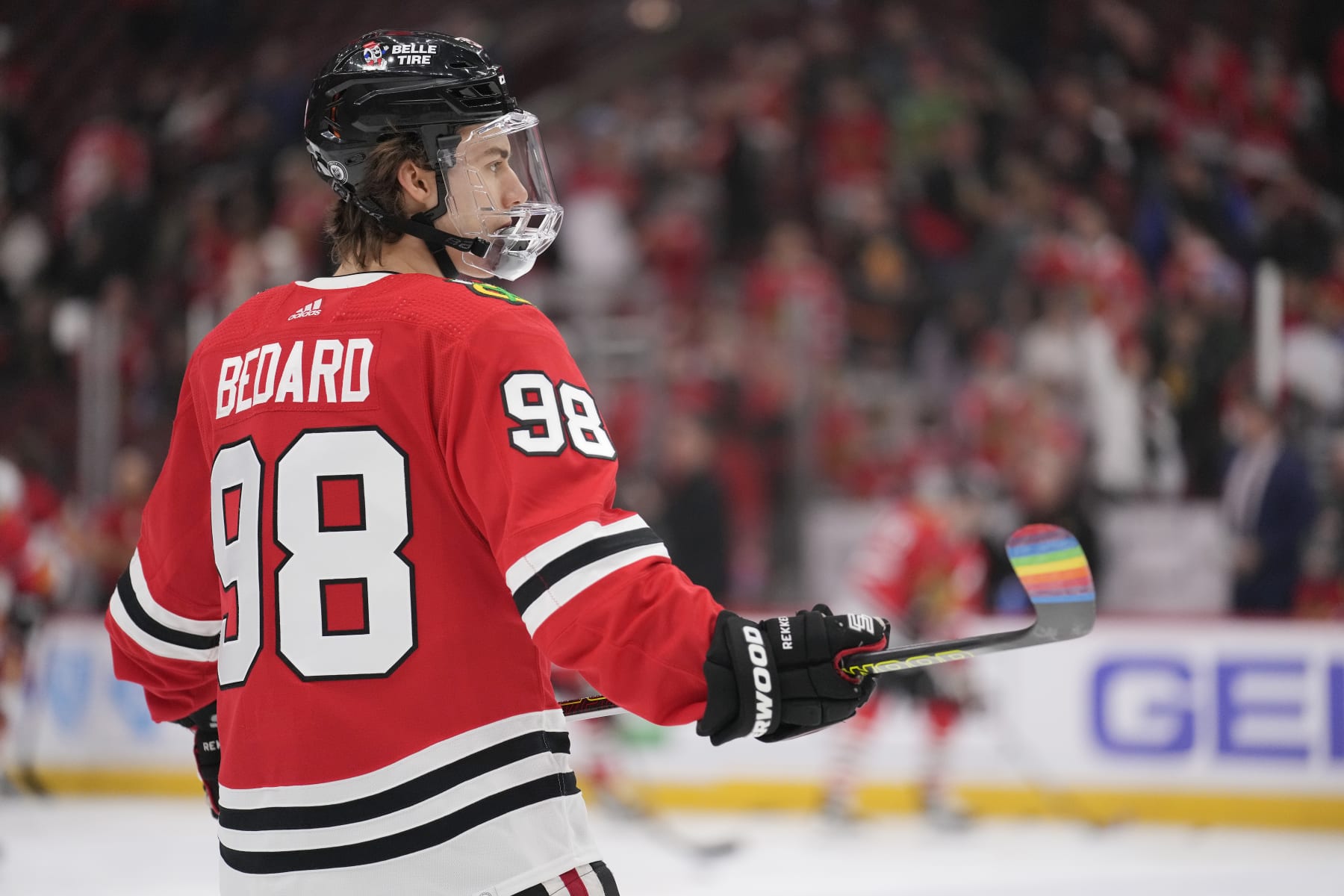 CHICAGO, ILLINOIS - MARCH 26: Connor Bedard #98 of the Chicago Blackhawks warms up with pride tape on his stick before a game against the Calgary Flames at the United Center on March 26, 2024 in Chicago, Illinois. (Photo by Patrick McDermott/Getty Images)
