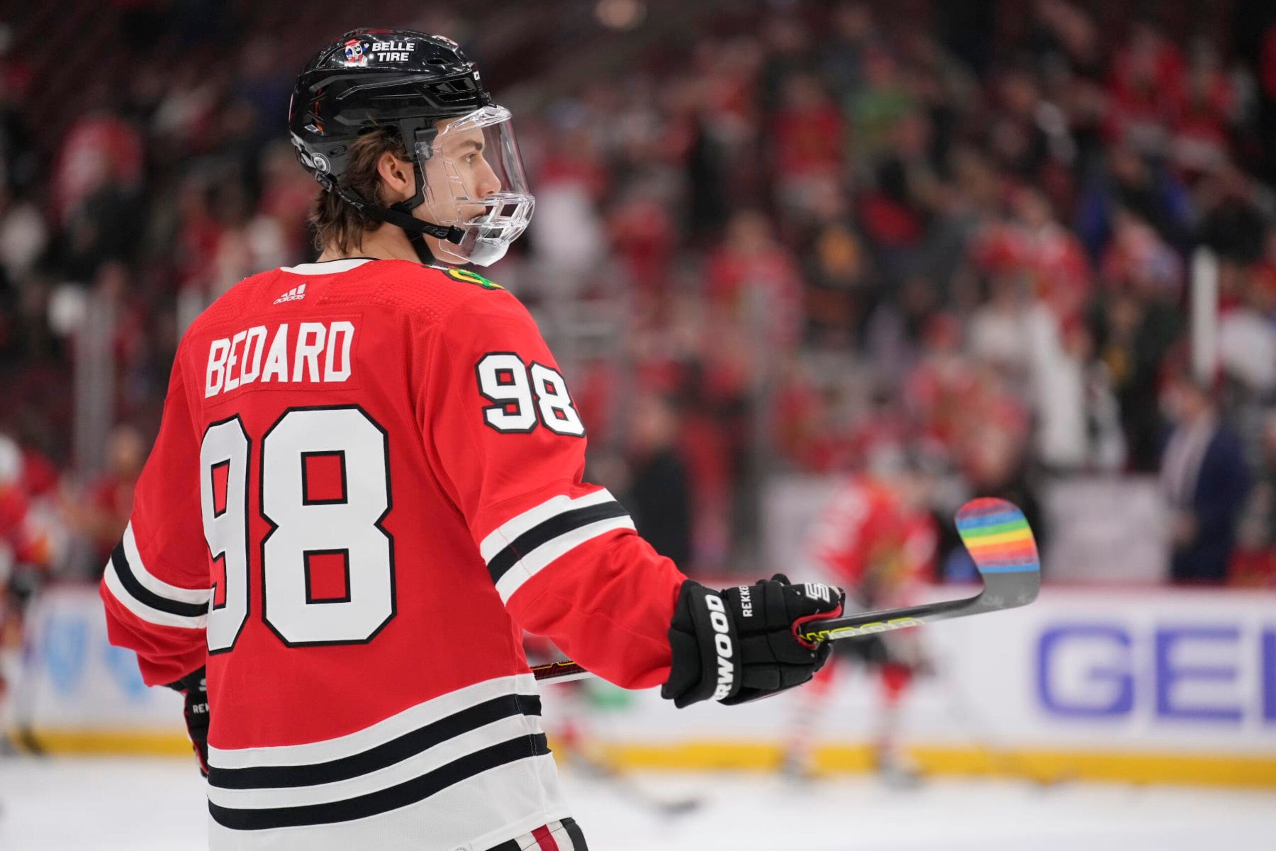 CHICAGO, ILLINOIS - MARCH 26: Connor Bedard #98 of the Chicago Blackhawks warms up with pride tape on his stick before a game against the Calgary Flames at the United Center on March 26, 2024 in Chicago, Illinois. (Photo by Patrick McDermott/Getty Images)