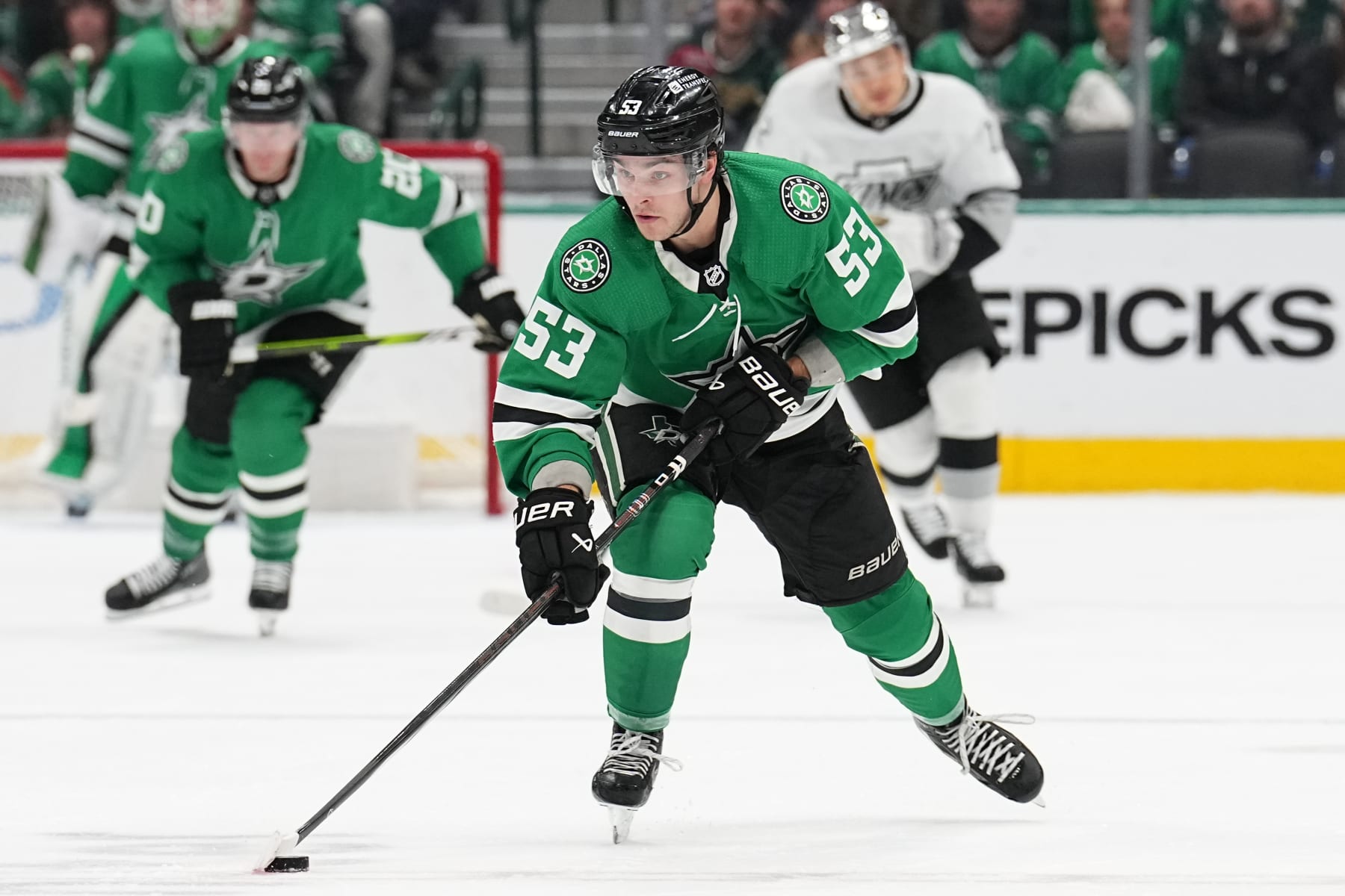 DALLAS, TX - MARCH 16: Wyatt Johnston #53 of the Dallas Stars handles the puck against the Los Angeles Kings at the American Airlines Center on March 16, 2024 in Dallas, Texas. (Photo by Glenn James/NHLI via Getty Images)