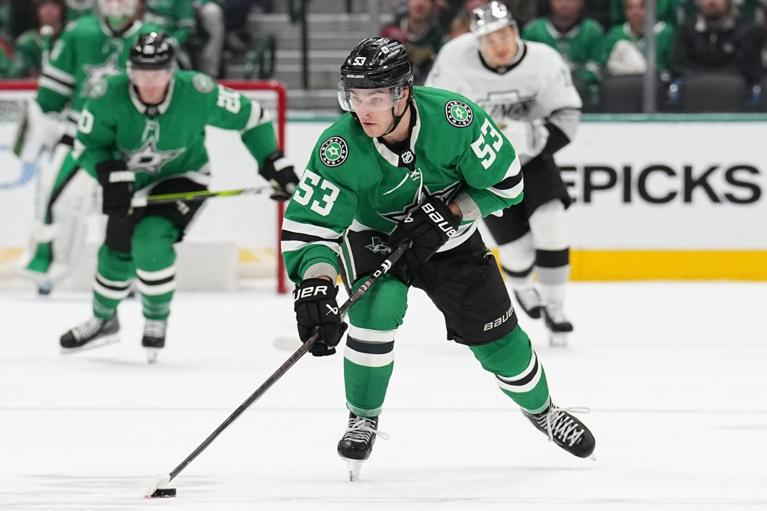 DALLAS, TX - MARCH 16: Wyatt Johnston #53 of the Dallas Stars handles the puck against the Los Angeles Kings at the American Airlines Center on March 16, 2024 in Dallas, Texas. (Photo by Glenn James/NHLI via Getty Images)