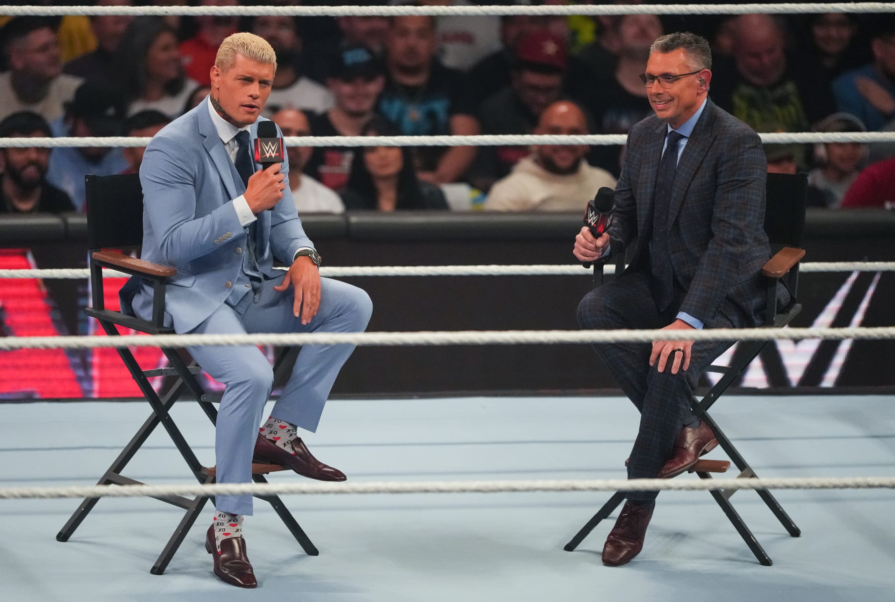 HOUSTON, TEXAS - MARCH 11: Cody Rhodes (L) is interviewed by Michael Cole (R) during WWE Monday Night RAW at Toyota Center on March 11, 2024 in Houston, Texas. (Photo by Alex Bierens de Haan/Getty Images)