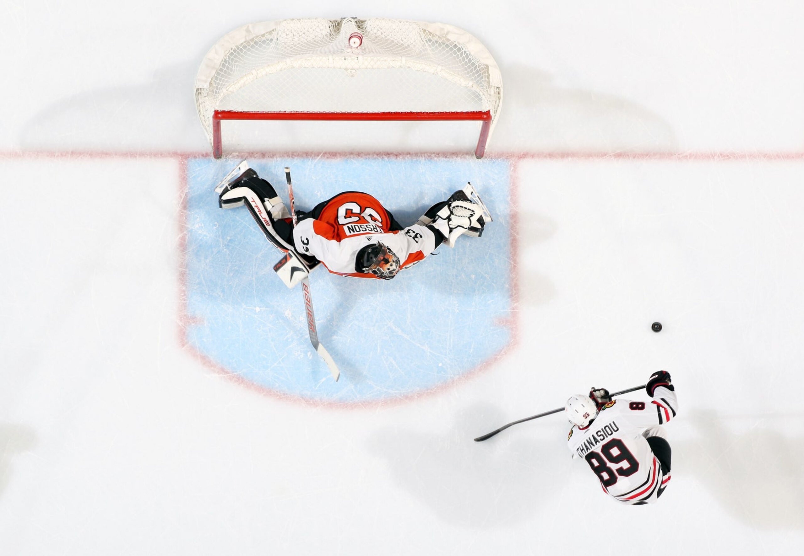 PHILADELPHIA, PENNSYLVANIA - MARCH 30:  Samuel Ersson #33 of the Philadelphia Flyers reacts to a shot on goal by Andreas Athanasiou #89 of the Chicago Blackhawks at the Wells Fargo Center on March 30, 2024 in Philadelphia, Pennsylvania.  (Photo by Len Redkoles/NHLI via Getty Images)