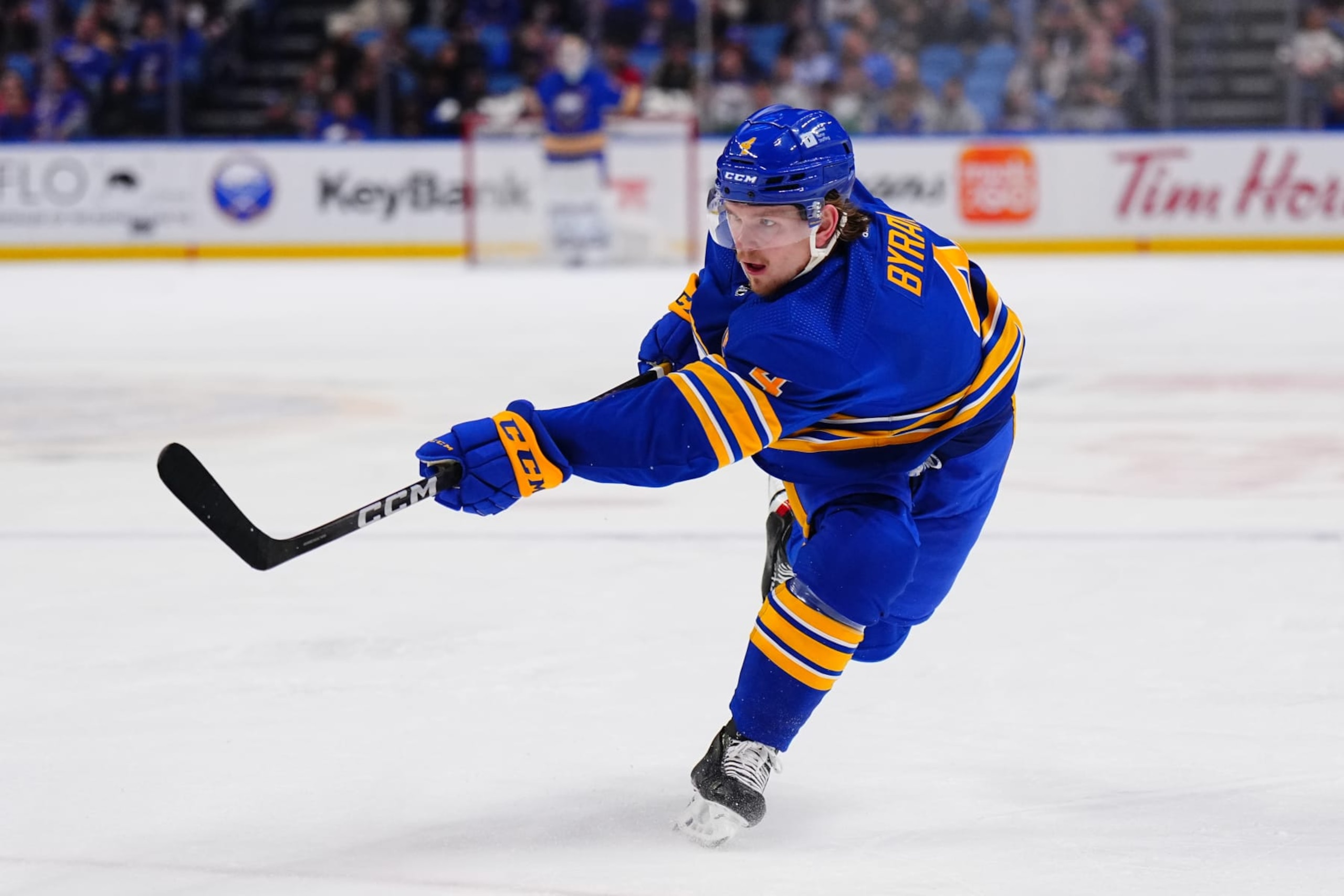 BUFFALO, NEW YORK - MARCH 27: Bowen Byram #4 of the Buffalo Sabres fires a shot against the Ottawa Senators during an NHL game on March 27, 2024 at KeyBank Center in Buffalo, New York. (Photo by Ben Ludeman/NHLI via Getty Images)