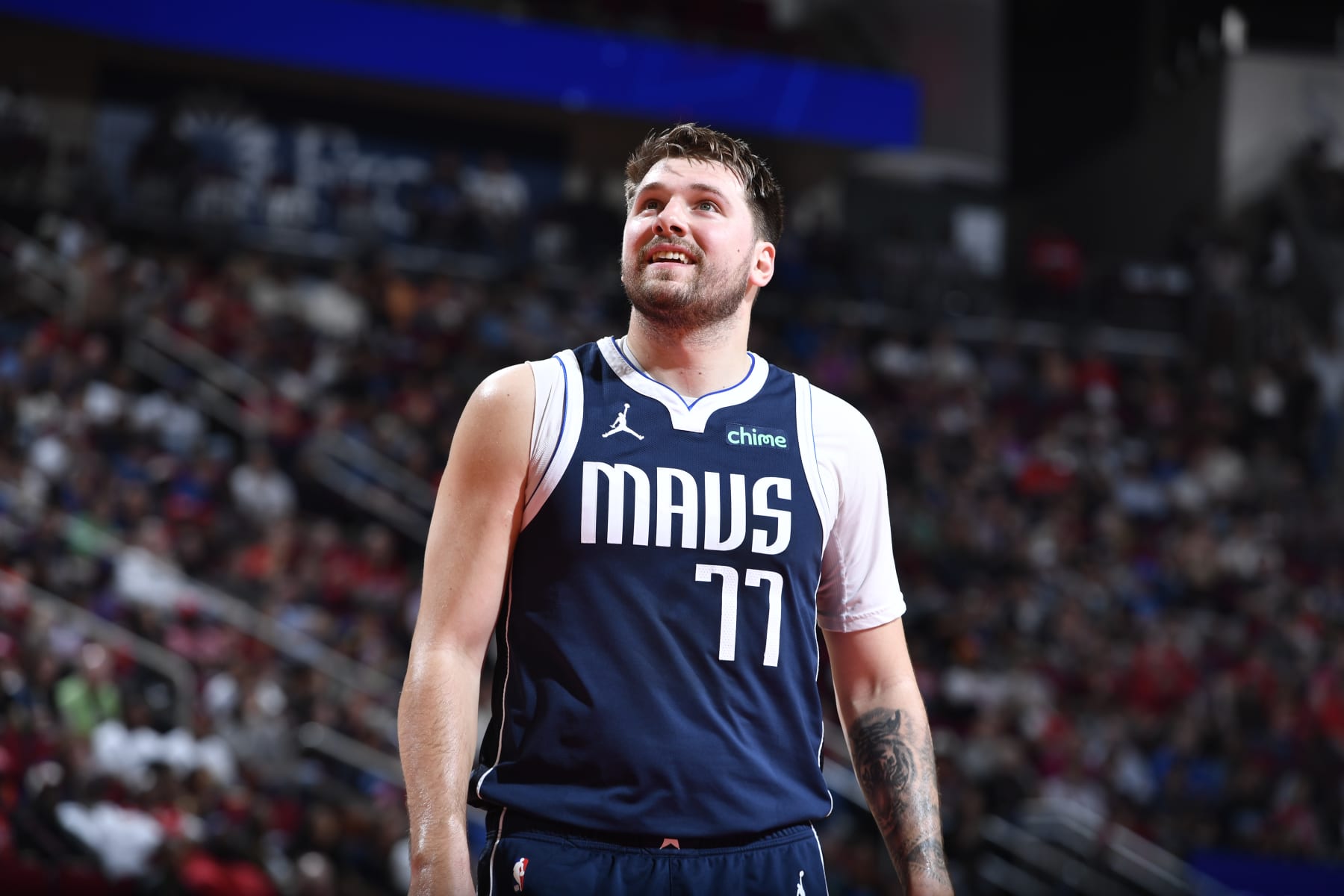 HOUSTON, TX - MARCH 31: Luka Doncic #77 of the Dallas Mavericks looks on during the game against the Houston Rockets on March 31, 2024 at the Toyota Center in Houston, Texas. NOTE TO USER: User expressly acknowledges and agrees that, by downloading and or using this photograph, User is consenting to the terms and conditions of the Getty Images License Agreement. Mandatory Copyright Notice: Copyright 2024 NBAE (Photo by Logan Riely/NBAE via Getty Images)