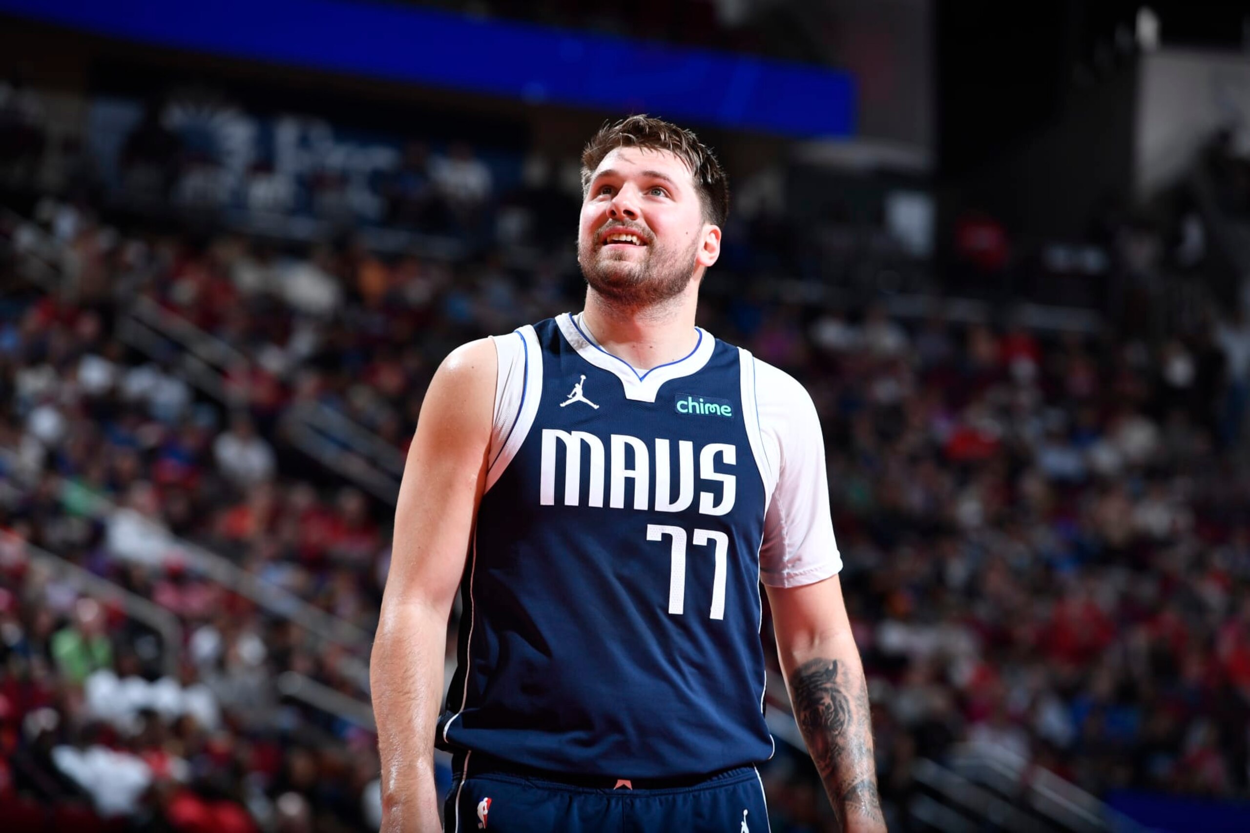 HOUSTON, TX - MARCH 31: Luka Doncic #77 of the Dallas Mavericks looks on during the game against the Houston Rockets on March 31, 2024 at the Toyota Center in Houston, Texas. NOTE TO USER: User expressly acknowledges and agrees that, by downloading and or using this photograph, User is consenting to the terms and conditions of the Getty Images License Agreement. Mandatory Copyright Notice: Copyright 2024 NBAE (Photo by Logan Riely/NBAE via Getty Images) HOUSTON, TX - MARCH 31: Luka Doncic #77 of the Dallas Mavericks looks on during the game against the Houston Rockets on March 31, 2024 at the Toyota Center in Houston, Texas. NOTE TO USER: User expressly acknowledges and agrees that, by downloading and or using this photograph, User is consenting to the terms and conditions of the Getty Images License Agreement. Mandatory Copyright Notice: Copyright 2024 NBAE (Photo by Logan Riely/NBAE via Getty Images)