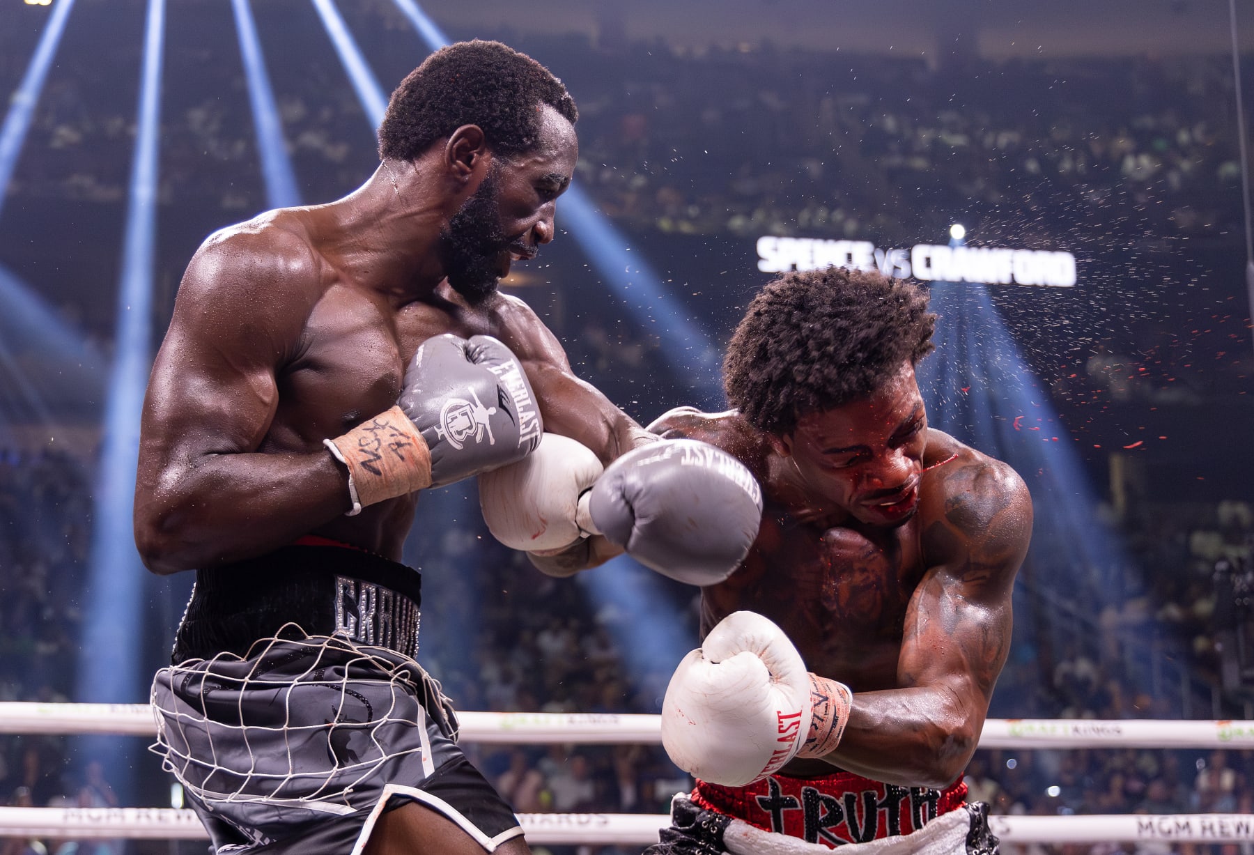 LAS VEGAS, NEVADA - JULY 29:  Terence Crawford punches Errol Spence Jr. during round 7 of their World Welterweight Championship bout at T-Mobile Arena on July 29, 2023 in Las Vegas, Nevada. (Photo by Al Bello/Getty Images)