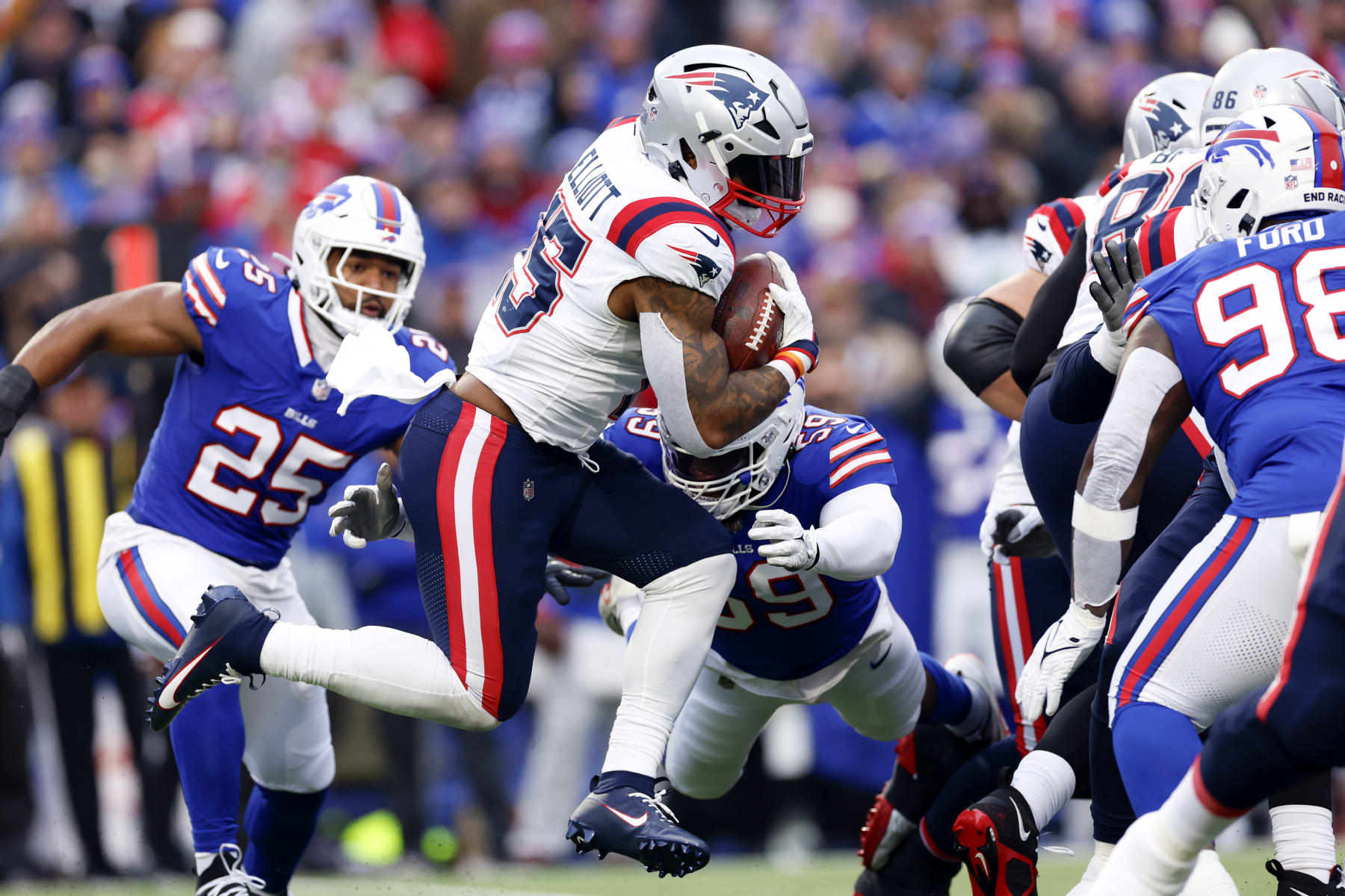 Orchard Park, NY - December 31: New England Patriots RB Ezekiel Elliott runs in the first half. The Patriots lost to the Buffalo Bills, 27-21. (Photo by Danielle Parhizkaran/The Boston Globe via Getty Images)