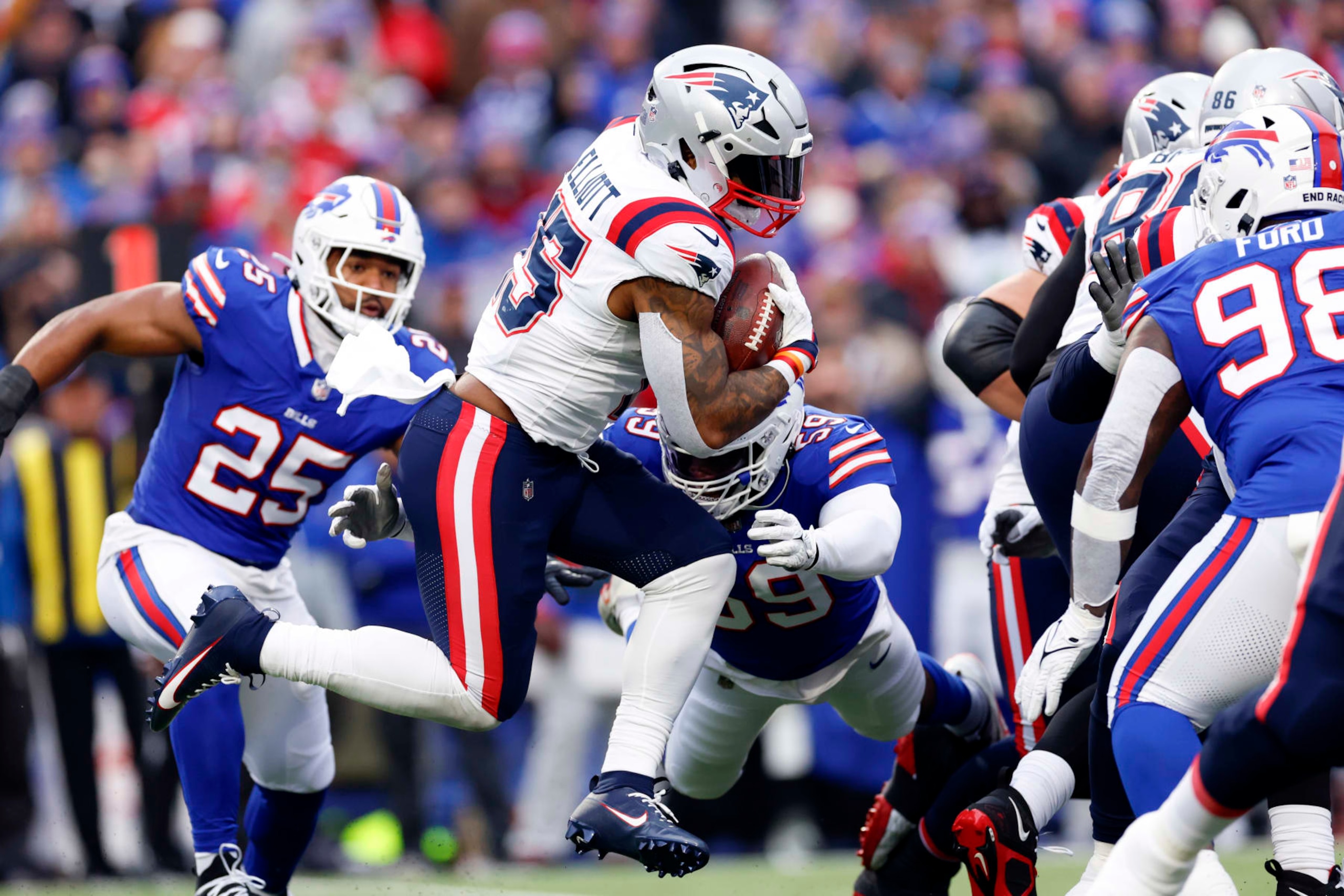 Orchard Park, NY - December 31: New England Patriots RB Ezekiel Elliott runs in the first half. The Patriots lost to the Buffalo Bills, 27-21. (Photo by Danielle Parhizkaran/The Boston Globe via Getty Images)
