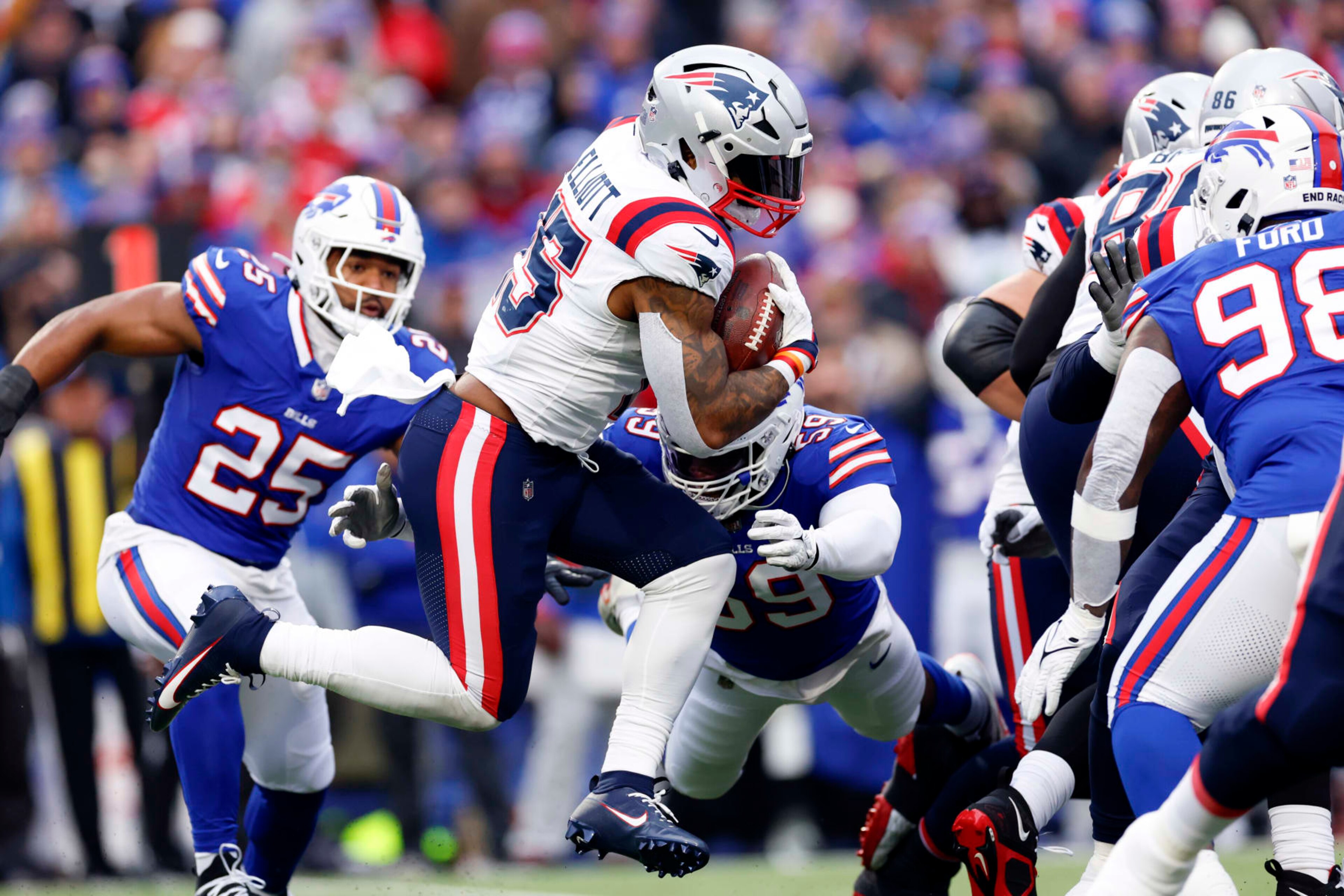 Orchard Park, NY - December 31: New England Patriots RB Ezekiel Elliott runs in the first half. The Patriots lost to the Buffalo Bills, 27-21. (Photo by Danielle Parhizkaran/The Boston Globe via Getty Images)