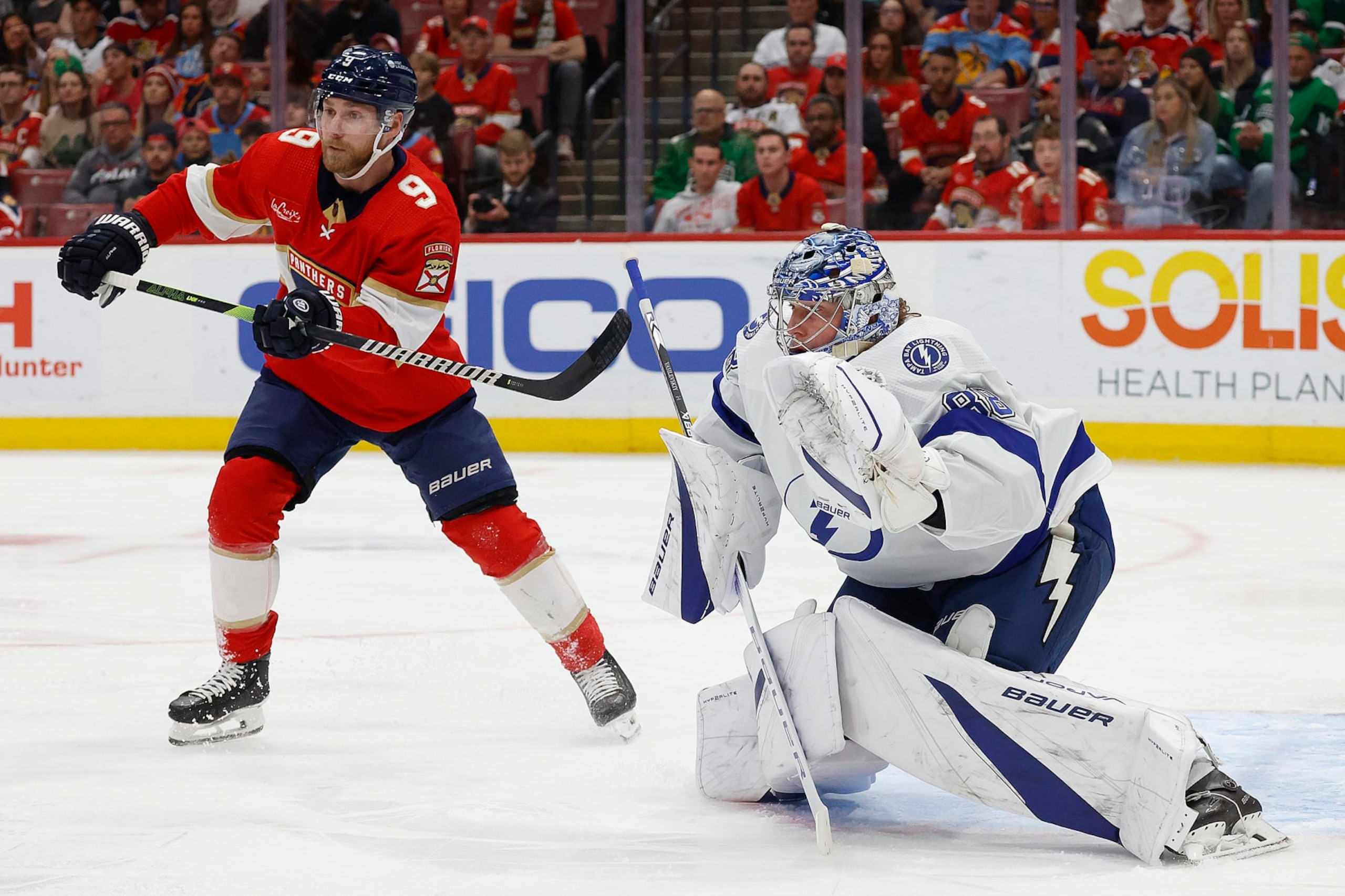 SUNRISE, FLORIDA - MARCH 16: Goaltender Andrei Vasilevskiy #88 of the Tampa Bay Lightning defends the net against Sam Bennett #9 of the Florida Panthers at the Amerant Bank Arena on March 16, 2024 in Sunrise, Florida. (Photo by Eliot J. Schechter/NHLI via Getty Images)