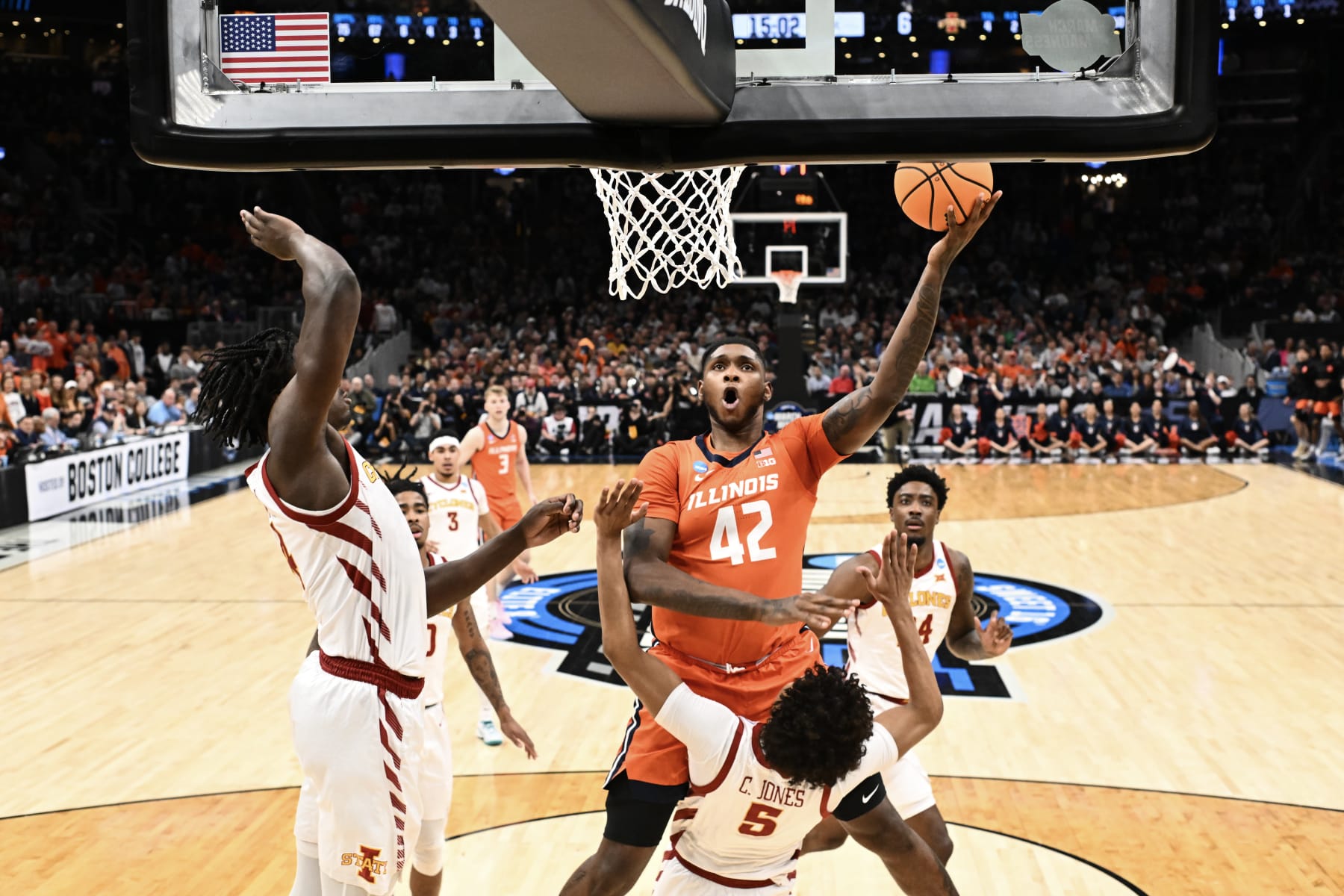 SALT LAKE CITY, UTAH - MARCH 21: Dain Dainja #42 of the Illinois Fighting Illini does a layup against Curtis Jones #5 of the Iowa State Cyclones during the first half of the Sweet Sixteen round of the 2024 NCAA Men's Basketball Tournament held at TD Garden on March 28, 2024 in Boston, Massachusetts. (Photo by Brett Wilhelm/NCAA Photos via Getty Images)