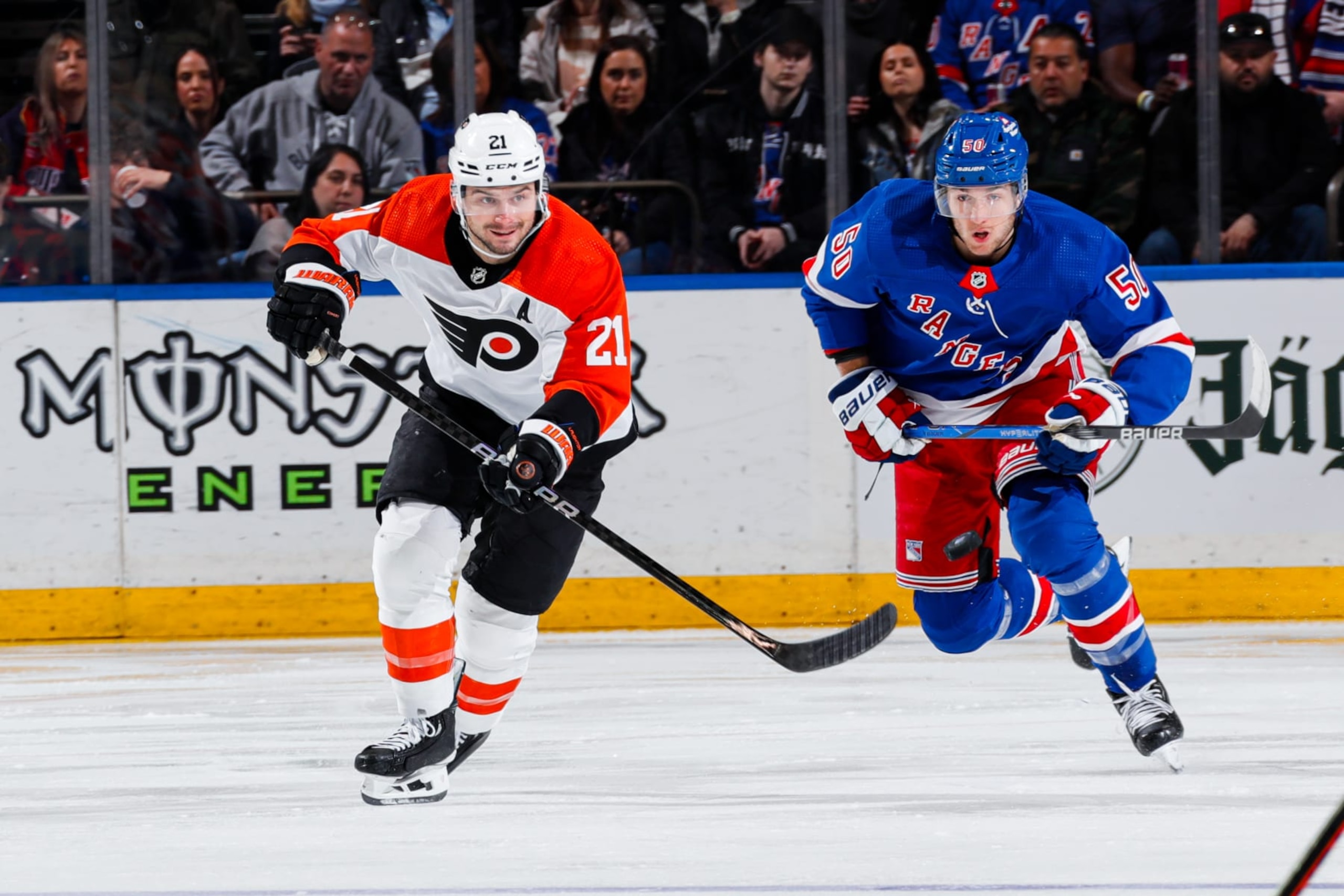 NEW YORK, NEW YORK - MARCH 26:  Scott Laughton #21 of the Philadelphia Flyers skates against Will Cuylle #50 of the New York Rangers at Madison Square Garden on March 26, 2024 in New York City. (Photo by Jared Silber/NHLI via Getty Images)