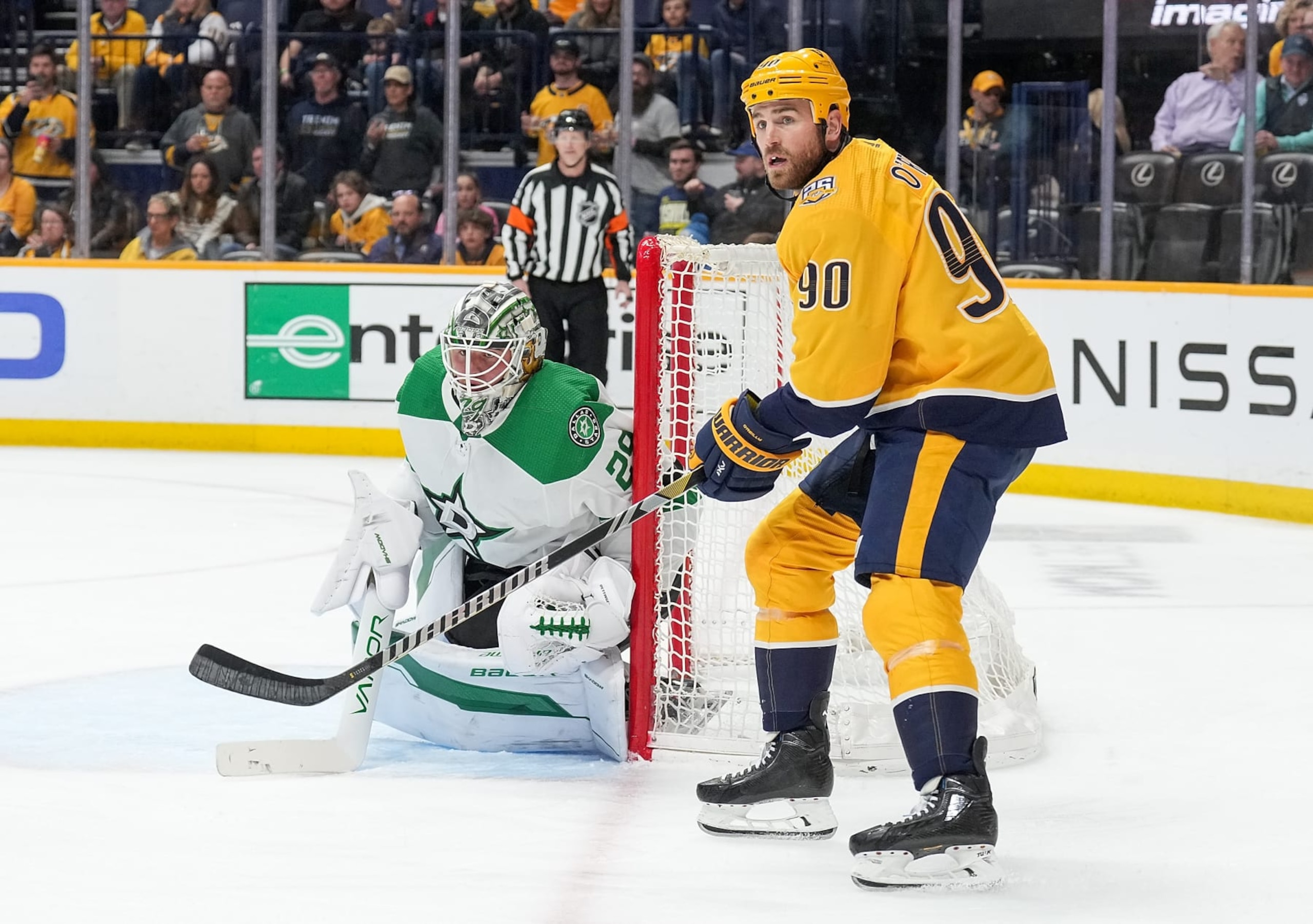 NASHVILLE, TENNESSEE - FEBRUARY 15: Ryan O'Reilly #90 of the Nashville Predators skates against the Jake Oettinger #29 of the Dallas Stars during an NHL game at Bridgestone Arena on February 15, 2024 in Nashville, Tennessee. (Photo by John Russell/NHLI via Getty Images)