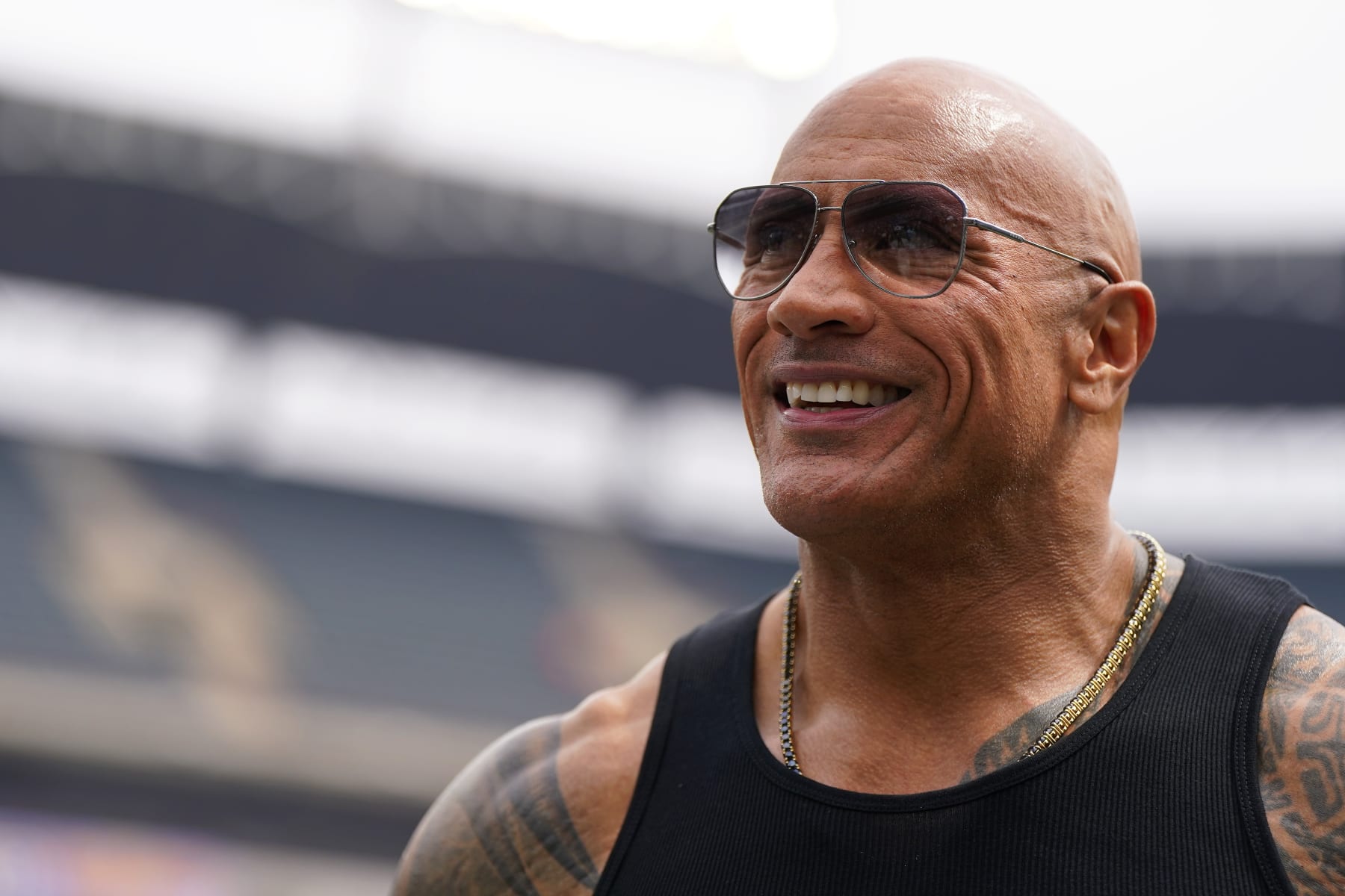 ARLINGTON, TEXAS - MARCH 30: Entertainer and owner The Rock reacts prior to a game between the Birmingham Stallions and Arlington Renegades at Choctaw Stadium on March 30, 2024 in Arlington, Texas. (Photo by Sam Hodde/UFL/Getty Images)