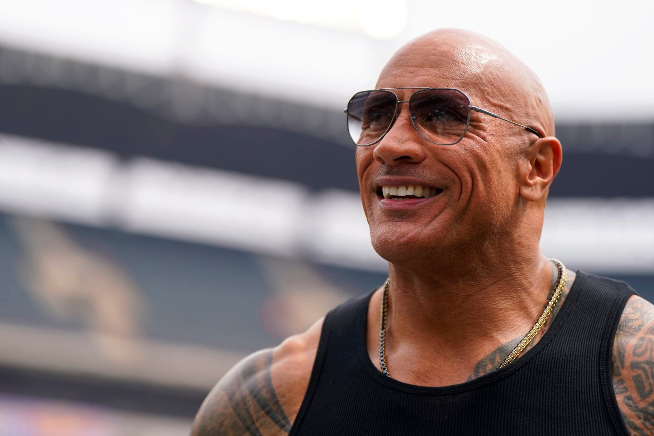 ARLINGTON, TEXAS - MARCH 30: Entertainer and owner The Rock reacts prior to a game between the Birmingham Stallions and Arlington Renegades at Choctaw Stadium on March 30, 2024 in Arlington, Texas. (Photo by Sam Hodde/UFL/Getty Images)