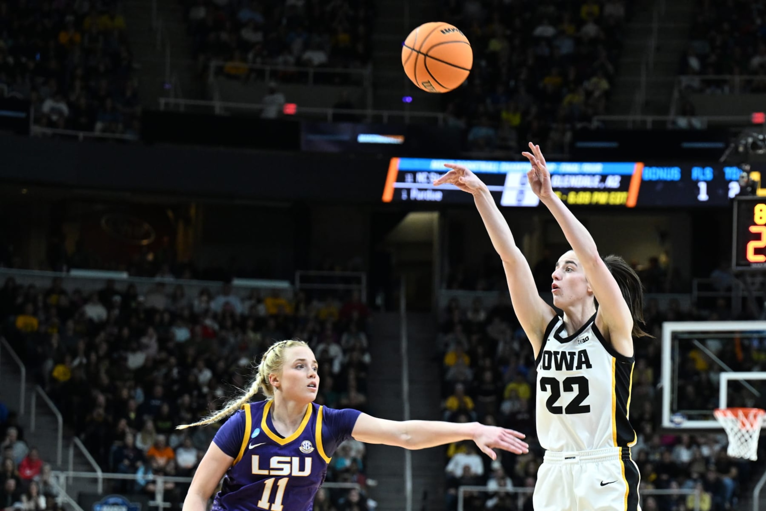 ALBANY, NEW YORK - APRIL 01: Caitlin Clark #22 of the Iowa Hawkeyes attempts a 3-point show over Hailey Van Lith #11 of the LSU Lady Tigers during the Elite Eight round of the 2024 NCAA Women's Basketball Tournament held at MVP Arena on April 1, 2024 in Albany, New York. (Photo by Greg Fiume/NCAA Photos via Getty Images)