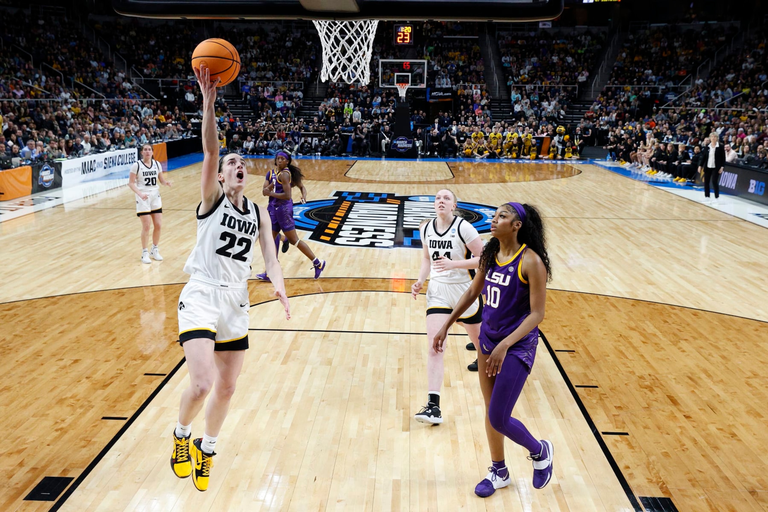 ALBANY, NEW YORK - APRIL 01: Caitlin Clark #22 of the Iowa Hawkeyes shoots the ball over Angel Reese #10 of the LSU Tigers during the first half in the Elite 8 round of the NCAA Women's Basketball Tournament at MVP Arena on April 01, 2024 in Albany, New York. (Photo by Sarah Stier/Getty Images)