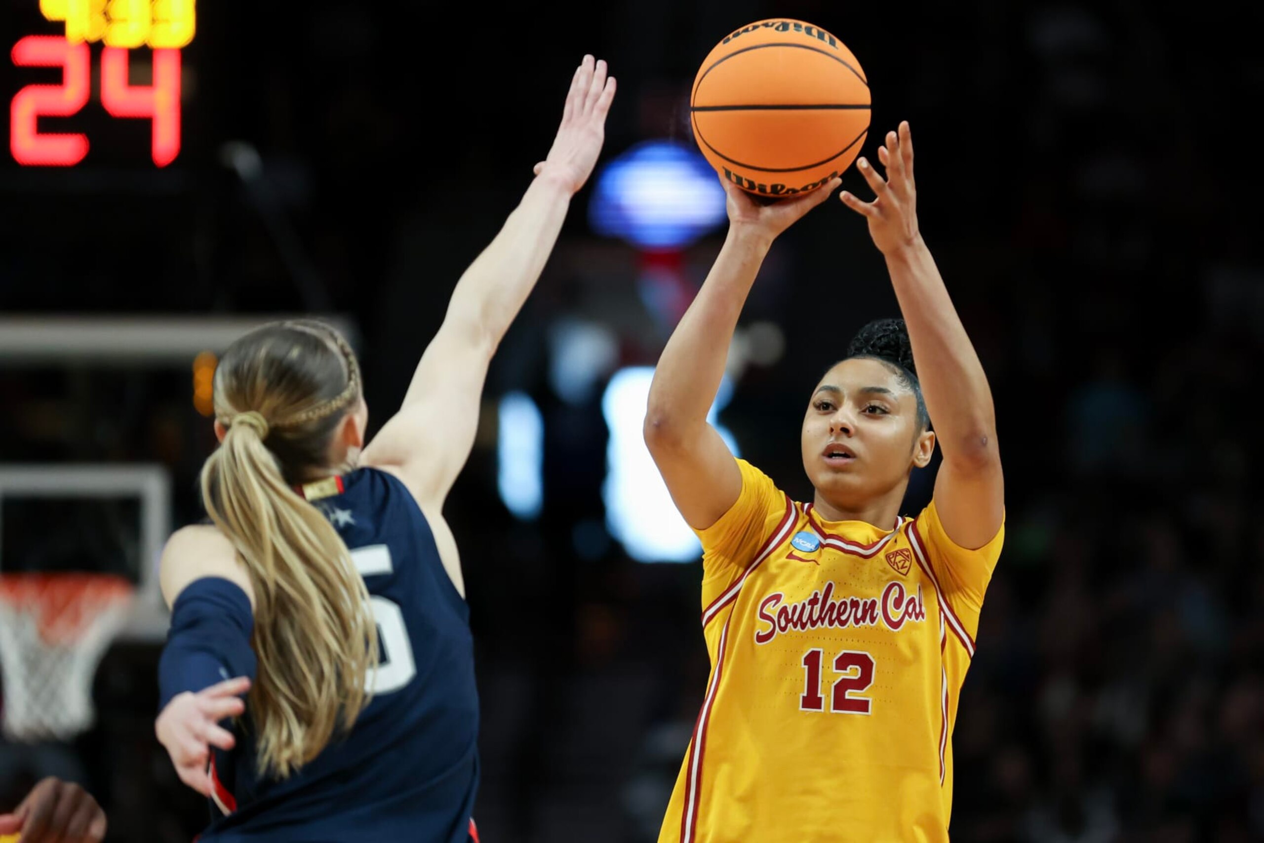 PORTLAND, OREGON - APRIL 01: JuJu Watkins #12 of the USC Trojans shoots over Paige Bueckers #5 of the Connecticut Huskies during the first half in the Elite 8 round of the NCAA Women's Basketball Tournament at Moda Center on April 01, 2024 in Portland, Oregon. (Photo by Steph Chambers/Getty Images) PORTLAND, OREGON - APRIL 01: JuJu Watkins #12 of the USC Trojans shoots over Paige Bueckers #5 of the Connecticut Huskies during the first half in the Elite 8 round of the NCAA Women's Basketball Tournament at Moda Center on April 01, 2024 in Portland, Oregon. (Photo by Steph Chambers/Getty Images)