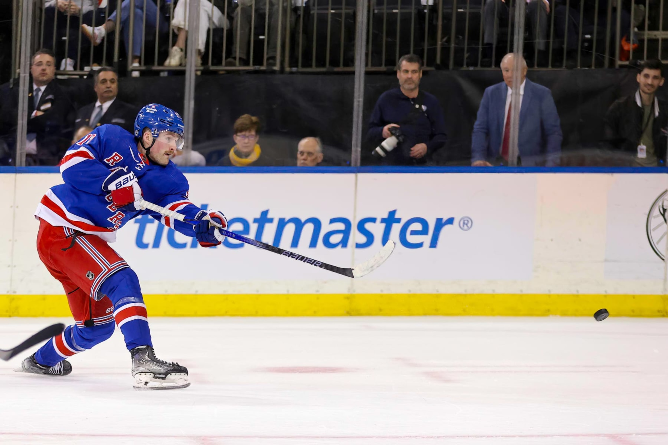 NEW YORK, NY - APRIL 01: New York Rangers Right Wing Alexis Lafreniere (13) takes a shot on goal during the second period of the National Hockey League game between the Pittsburgh Penguins and the New York Rangers on April 1, 2024 at Madison Square Garden in New York, NY. (Photo by Joshua Sarner/Icon Sportswire via Getty Images)