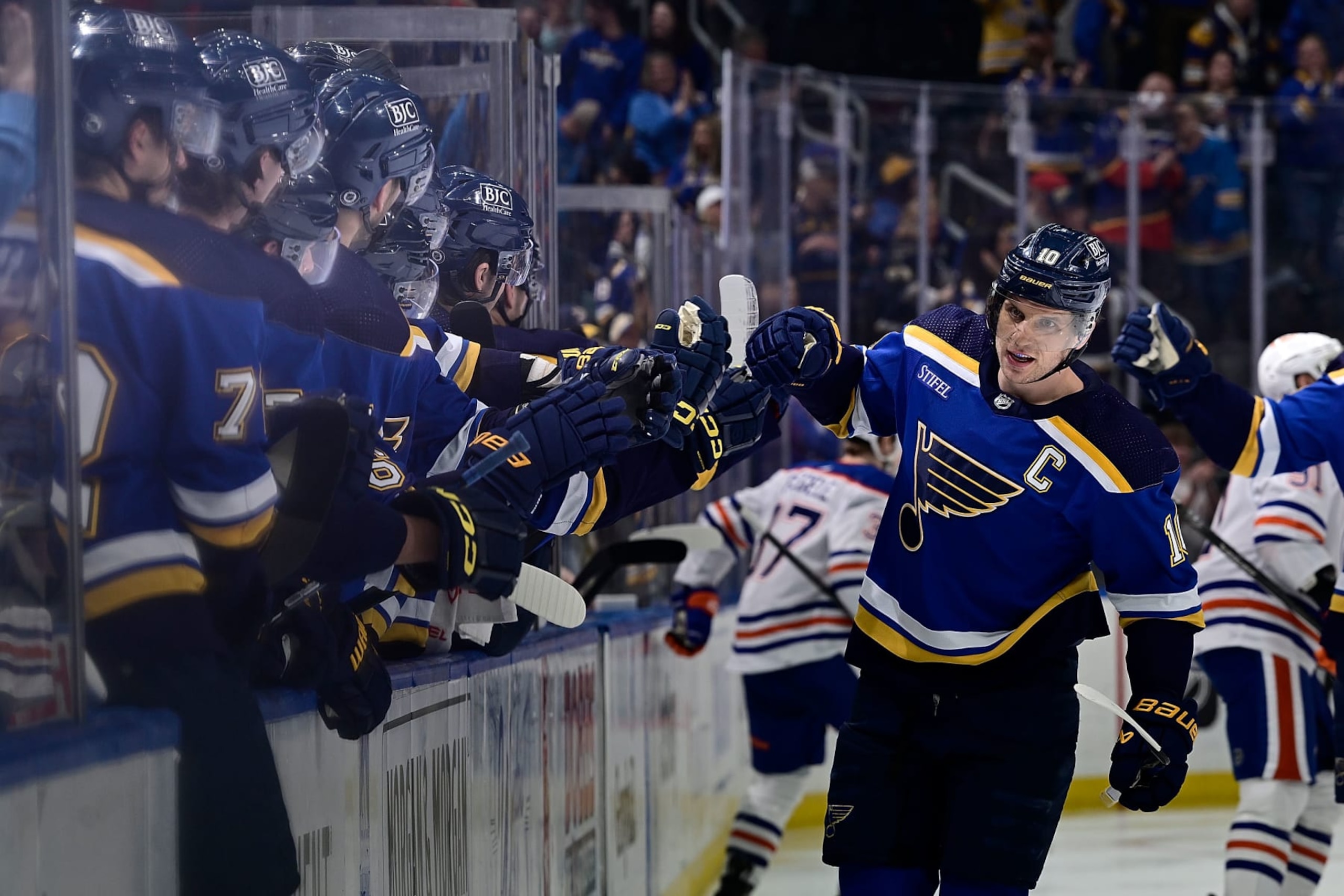 ST. LOUIS, MO - APRIL 1: Brayden Schenn #10 of the St. Louis Blues is congratulated after scoring a goal against the Edmonton Oilers on April 1, 2024 at the Enterprise Center in St. Louis, Missouri. (Photo by Scott Rovak/NHLI via Getty Images)