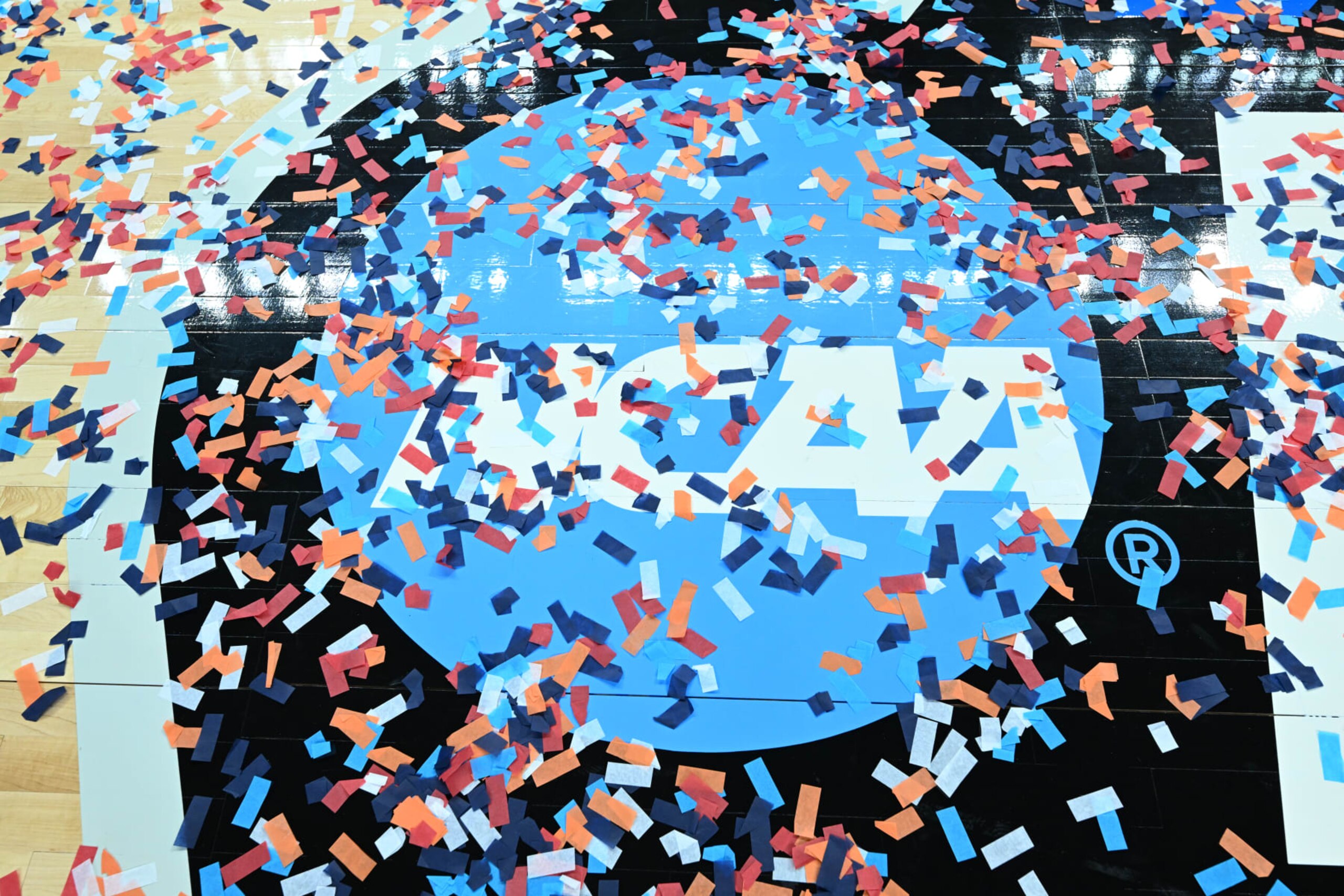 ALBANY, NEW YORK - MARCH 31: The NCAA logo is covered by confetti after the South Carolina Gamecocks defeat the Oregon State Beavers during the Elite Eight round of the 2024 NCAA Women's Basketball Tournament held at MVP Arena on March 31, 2024 in Albany, New York. (Photo by Greg Fiume/NCAA Photos via Getty Images) ALBANY, NEW YORK - MARCH 31: The NCAA logo is covered by confetti after the South Carolina Gamecocks defeat the Oregon State Beavers during the Elite Eight round of the 2024 NCAA Women's Basketball Tournament held at MVP Arena on March 31, 2024 in Albany, New York. (Photo by Greg Fiume/NCAA Photos via Getty Images)