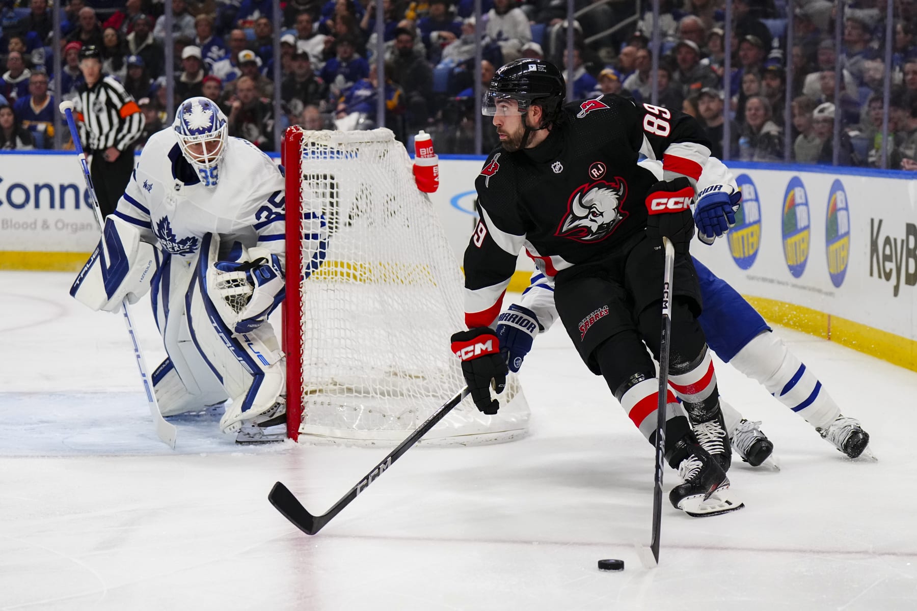 BUFFALO, NEW YORK - MARCH 30: Alex Tuch #89 of the Buffalo Sabres wraps around the net during an NHL game against the Toronto Maple Leafs on March 30, 2024 at KeyBank Center in Buffalo, New York. (Photo by Ben Ludeman/NHLI via Getty Images)