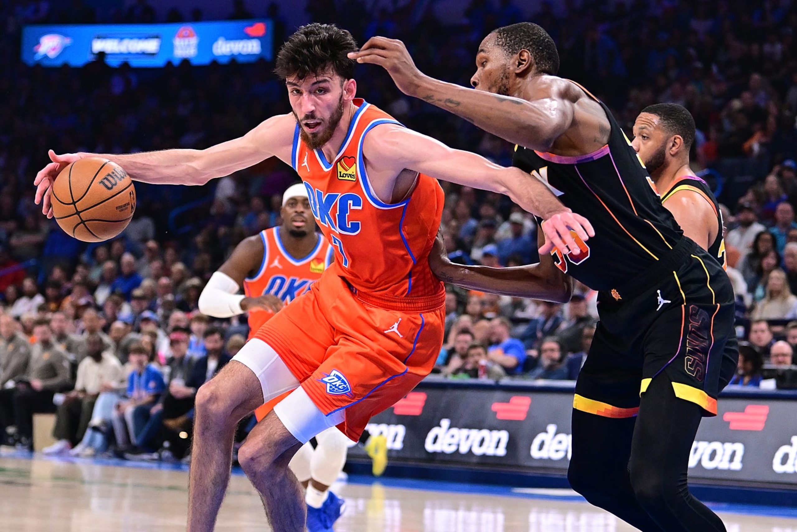 OKLAHOMA CITY, OKLAHOMA - MARCH 29: Chet Holmgren #7 of the Oklahoma City Thunder attempts to drive past Kevin Durant #35 of the Phoenix Suns during the first half at Paycom Center on March 29, 2024 in Oklahoma City, Oklahoma. NOTE TO USER: User expressly acknowledges and agrees that, by downloading and or using this Photograph, user is consenting to the terms and conditions of the Getty Images License Agreement. (Photo by Joshua Gateley/Getty Images)