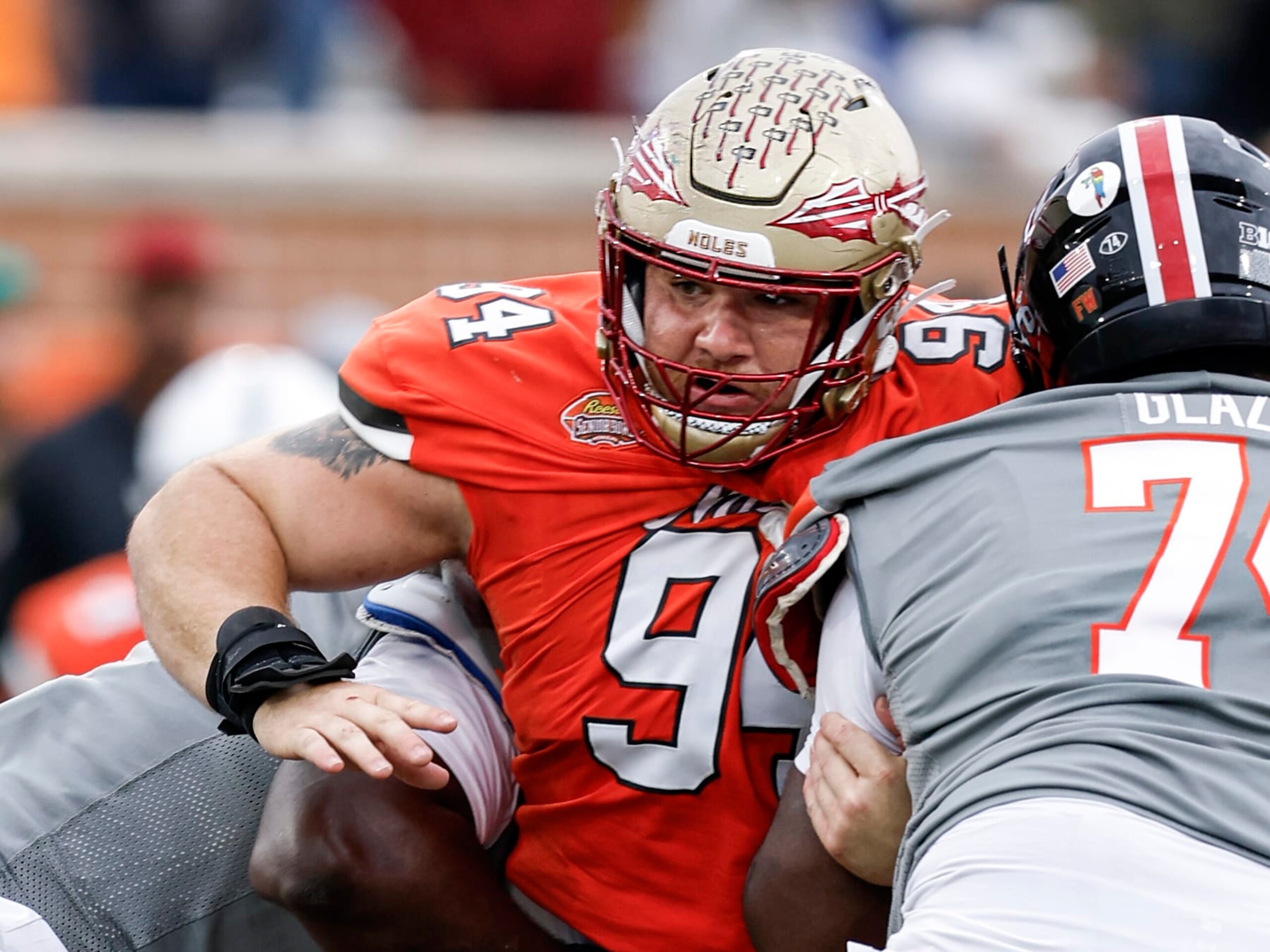MOBILE, AL - FEBRUARY 03: Defensive Lineman Braden Fiske #94 of Florida State from the National Team is being blocked by Offensive Lineman Delmar Glaze #74 of Maryland from the American Team during the 2024 Reese's Senior Bowl at Hancock Whitney Stadium on the campus of the University of South Alabama on February 3, 2024 in Mobile, Alabama. he National Team defeated the American Team 16 to 7. (Photo by Don Juan Moore/Getty Images)
