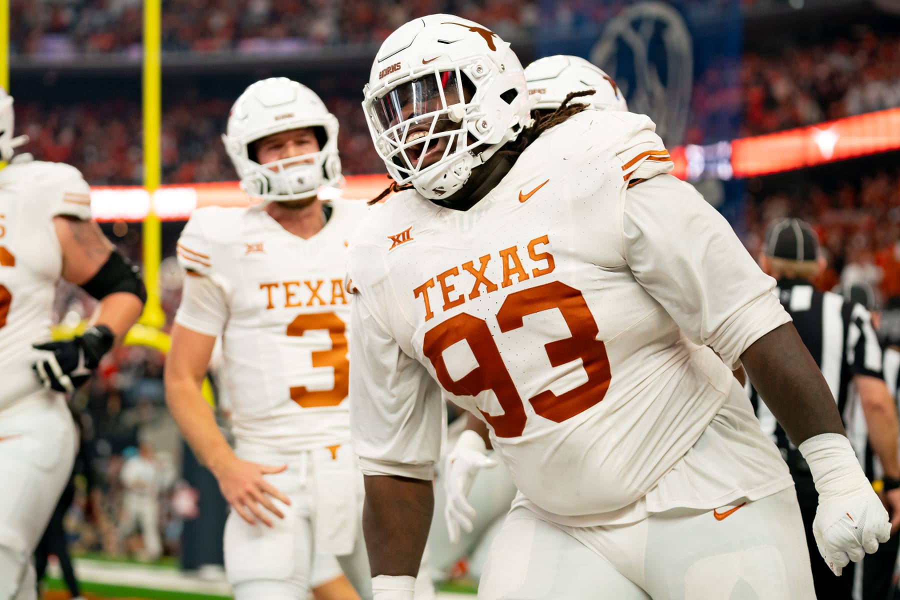 ARLINGTON, TX - DECEMBER 02: Texas Longhorns defensive lineman T'Vondre Sweat (93) celebrates catching a touchdown during the Big 12 Championship game between the Texas Longhorns and the Oklahoma State Cowboys   on December 02, 2023 at AT&T Stadium in Arlington, TX. (Photo by Chris Leduc/Icon Sportswire via Getty Images)
