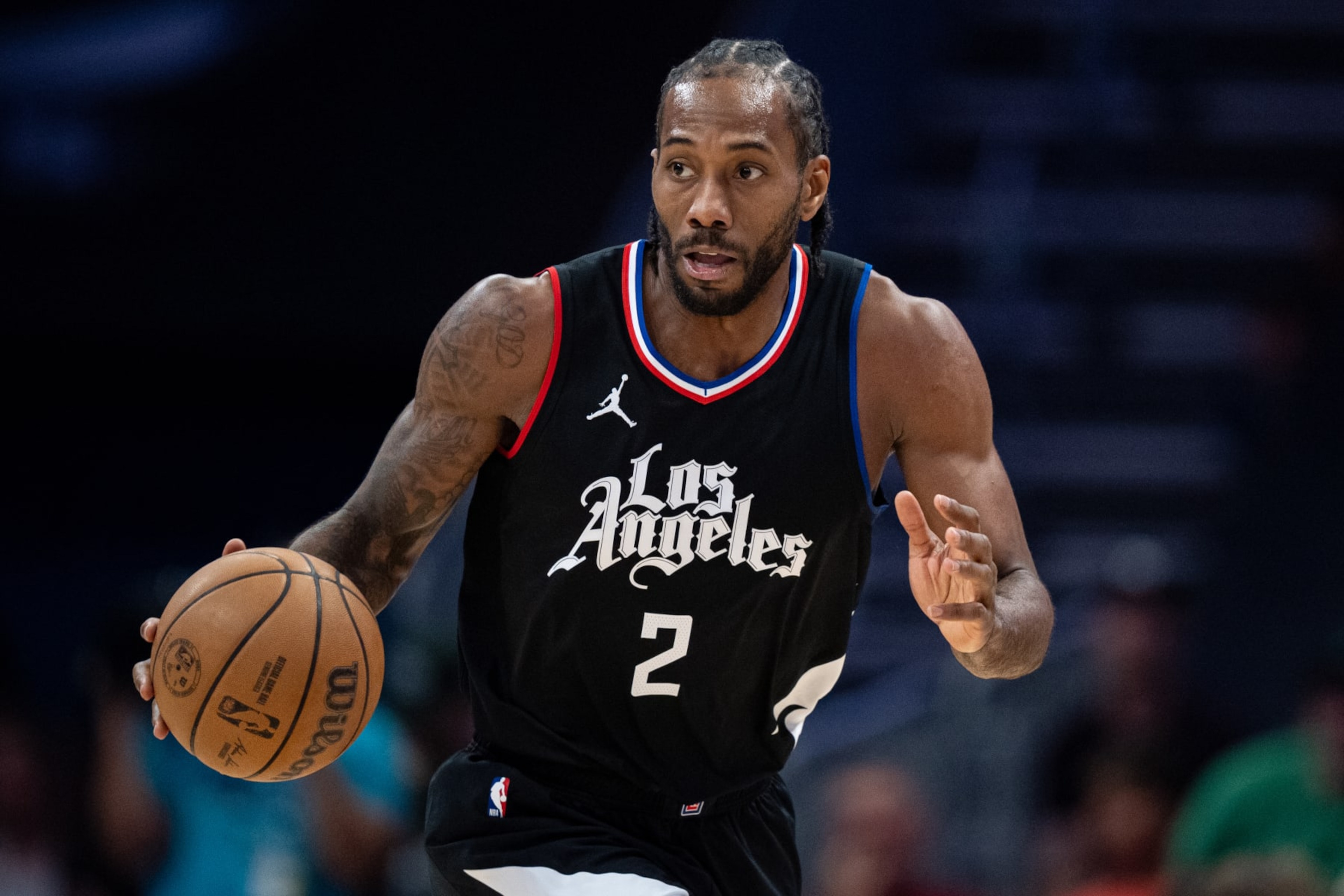 CHARLOTTE, NORTH CAROLINA - MARCH 31: Kawhi Leonard #2 of the LA Clippers brings the ball up court against the Charlotte Hornets during their game at Spectrum Center on March 31, 2024 in Charlotte, North Carolina. NOTE TO USER: User expressly acknowledges and agrees that, by downloading and or using this photograph, User is consenting to the terms and conditions of the Getty Images License Agreement. (Photo by Jacob Kupferman/Getty Images)