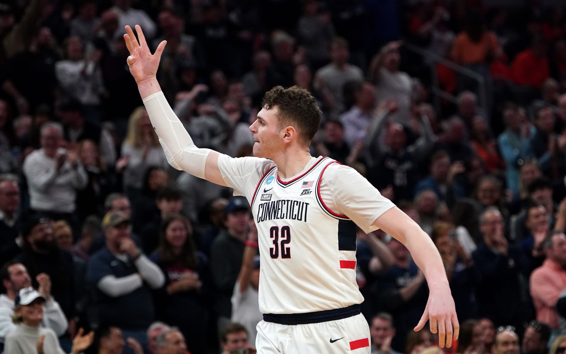 Boston, MA - March 30: UConn center Donovan Clingan celebrates after guard Cam Spencer, not pictured, drained a 3-pointer during the second half. UConn beat Illinois at TD Garden in the NCAA East Regional Final. (Photo by Barry Chin/The Boston Globe via Getty Images)