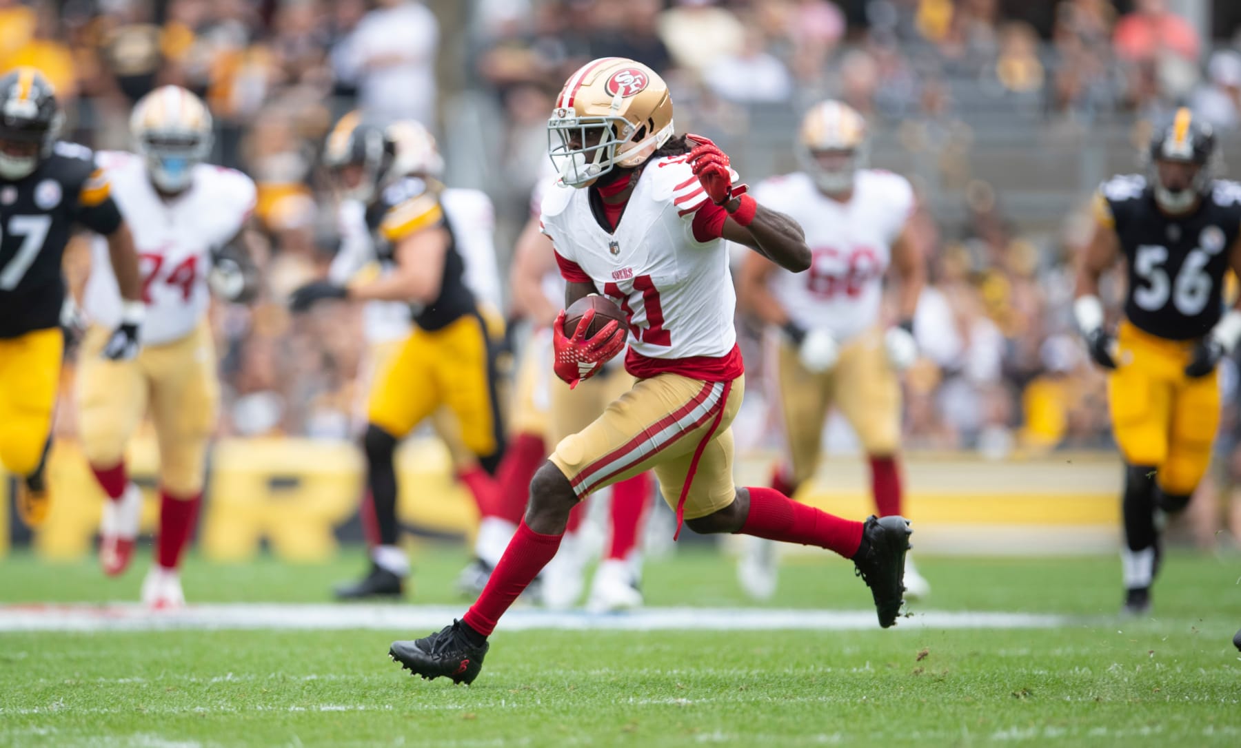 PITTSBURGH, PA - September 10: Brandon Aiyuk #11 of the San Francisco 49ers run after making a catch during the game against the Pittsburgh Steelers at Acrisure Stadium on September 10, 2023 in Pittsburgh, Pennsylvania. The 49ers defeated the Steelers 30-7. (Photo by Michael Zagaris/San Francisco 49ers/Getty Images)
