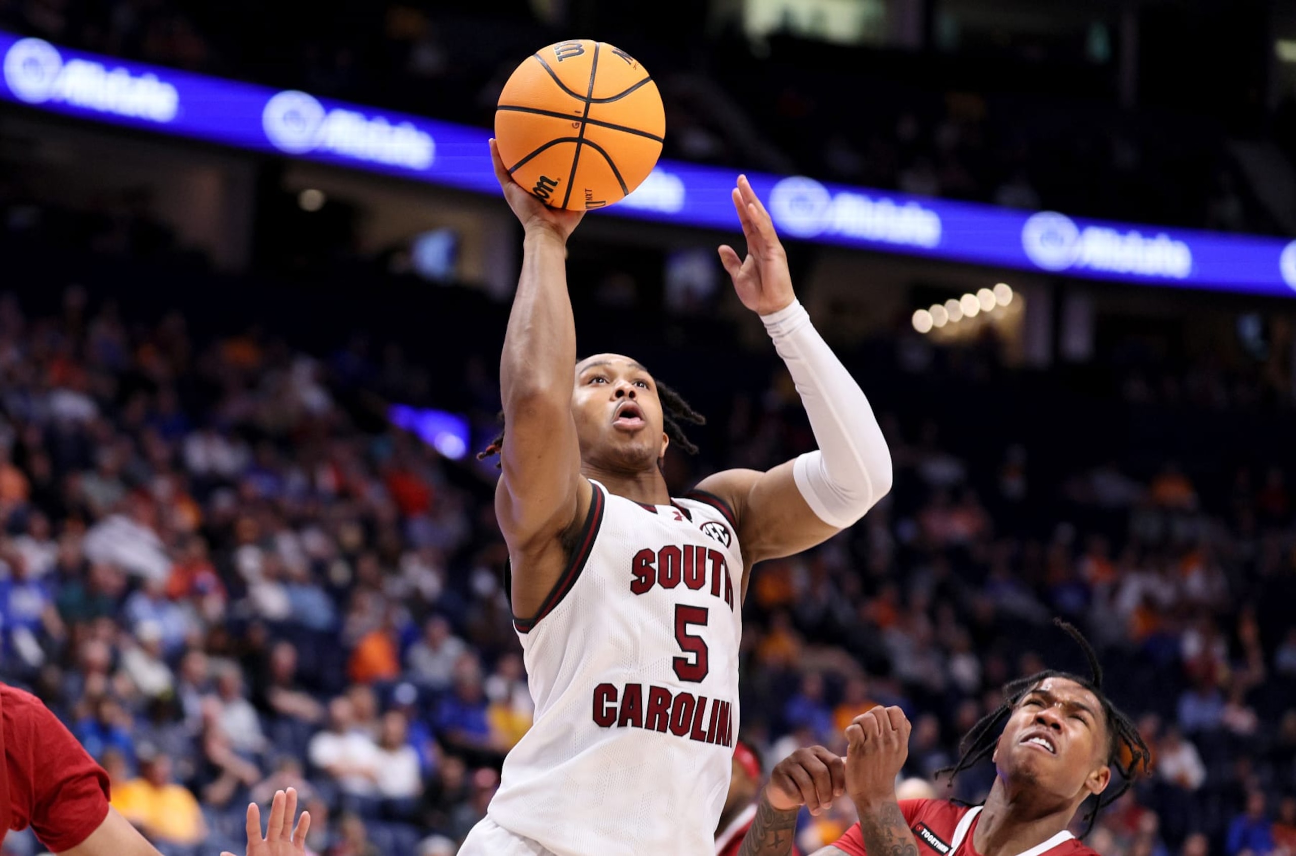 NASHVILLE, TENNESSEE - MARCH 14: Meechie Johnson #5 of the South Carolina Gamecocks shoots the ball against the Arkansas Razorbacks in the second half during the second round of the SEC Basketball Tournament at Bridgestone Arena on March 14, 2024 in Nashville, Tennessee.  (Ph oto by Andy Lyons/Getty Images)