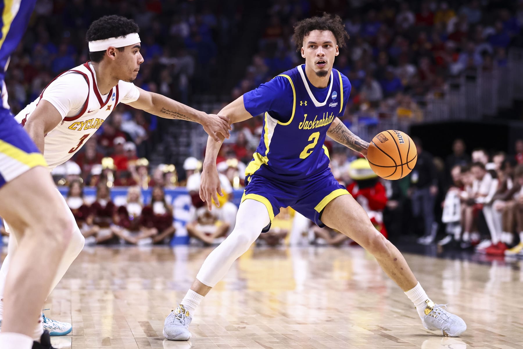 OMAHA, NEBRASKA - MARCH 21: Zeke Mayo #2 of the South Dakota State Jackrabbits dribbles the ball during the second half against the Iowa State Cyclones during the first round of the 2024 NCAA Men's Basketball Tournament held at CHI Health Center on March 21, 2024 in Omaha, Nebraska. (Photo by Tyler Schank/NCAA Photos via Getty Images)