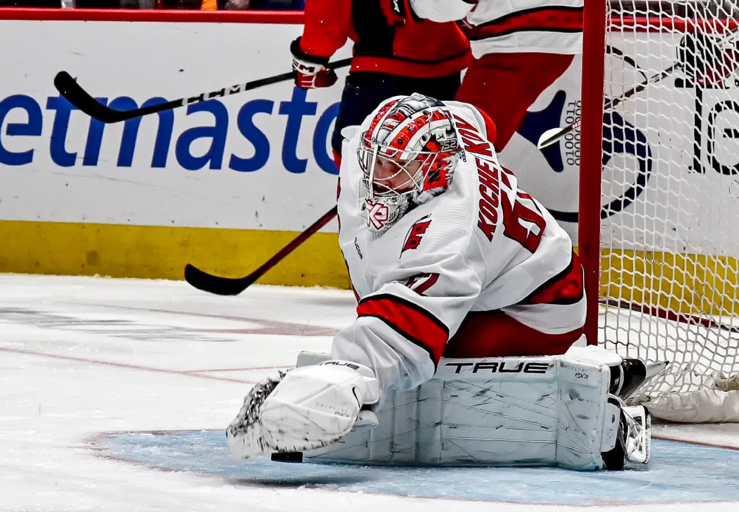 WASHINGTON, DC - MARCH 22: Carolina Hurricanes goaltender Pyotr Kochetkov (52) makes a save during the Carolina Hurricanes game versus the Washington Capitals on March 22, 2024 at the Capital One Arena in Washington, D.C.  (Photo by Mark Goldman/Icon Sportswire via Getty Images)