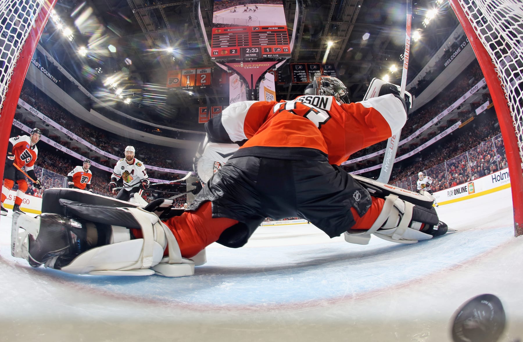 PHILADELPHIA, PENNSYLVANIA - MARCH 30: Goaltender Samuel Ersson #33 of the Philadelphia Flyers surrenders a second period power-play goal to Nick Foligno #17 of the Chicago Blackhawks at the Wells Fargo Center on March 30, 2024 in Philadelphia, Pennsylvania.  (Photo by Len Redkoles/NHLI via Getty Images)