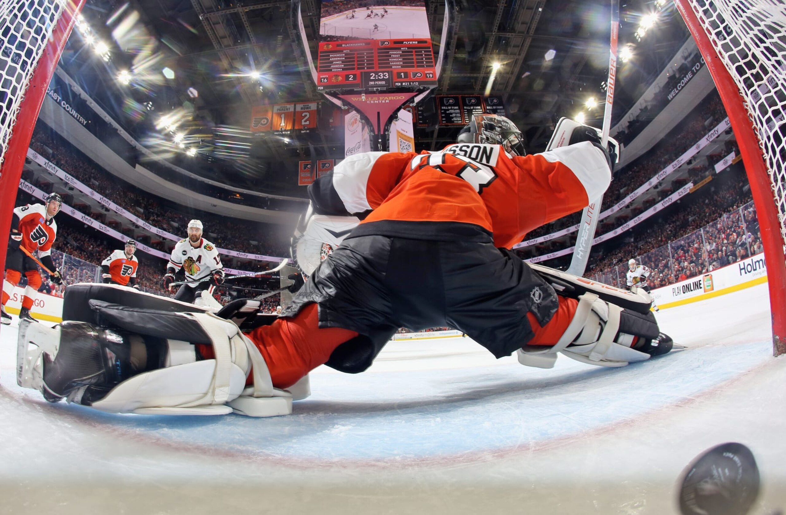 PHILADELPHIA, PENNSYLVANIA - MARCH 30: Goaltender Samuel Ersson #33 of the Philadelphia Flyers surrenders a second period power-play goal to Nick Foligno #17 of the Chicago Blackhawks at the Wells Fargo Center on March 30, 2024 in Philadelphia, Pennsylvania.  (Photo by Len Redkoles/NHLI via Getty Images)