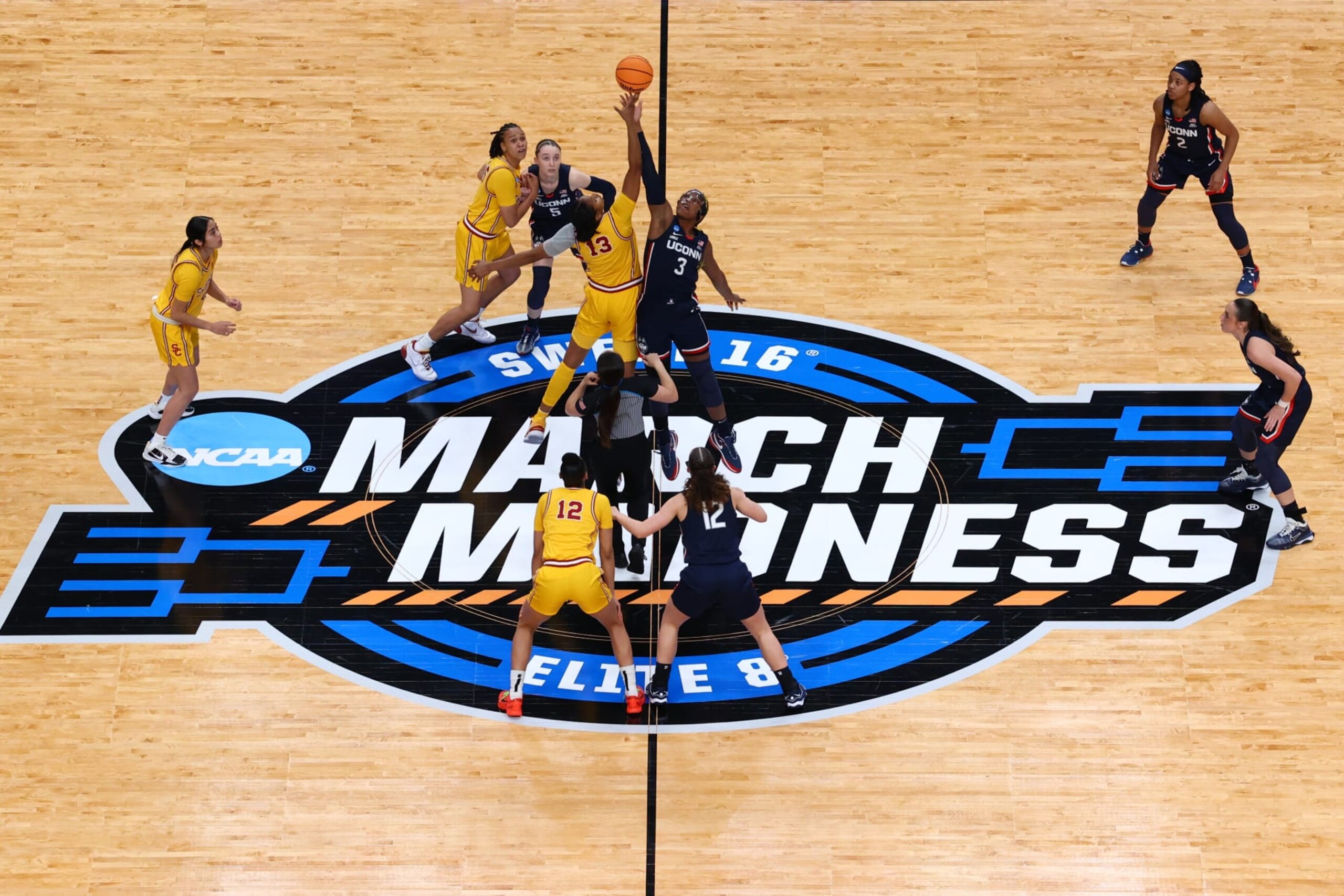 PORTLAND, OREGON - APRIL 01: Rayah Marshall #13 of the USC Trojans and Aaliyah Edwards #3 of the UConn Huskies jump for the opening tip off during the Elite Eight round of the 2024 NCAA Women's Basketball Tournament held at the Moda Center on April 1, 2024 in Portland, Oregon. (Photo by Tyler Schank/NCAA Photos via Getty Images)