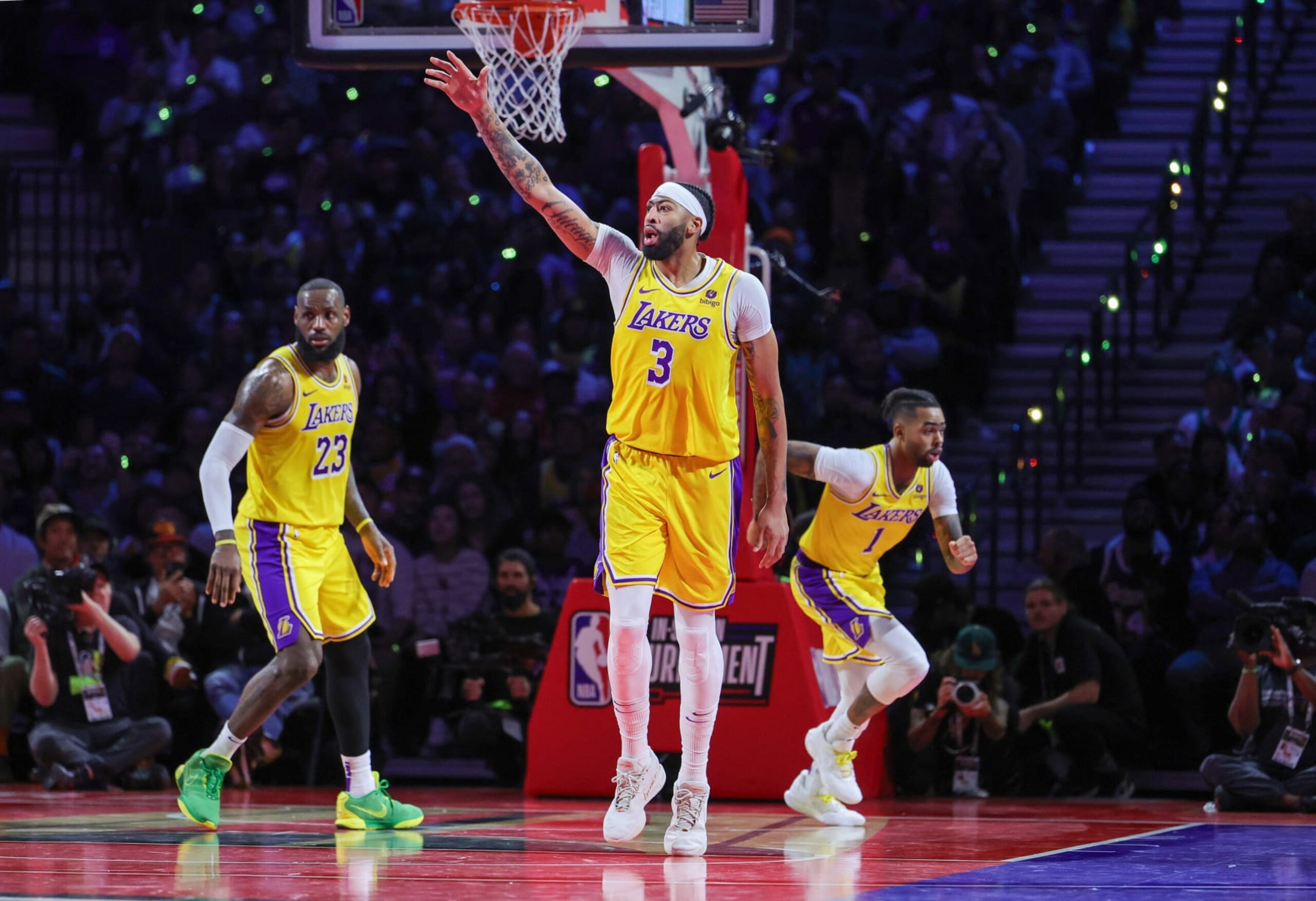 LAS VEGAS, NEVADA - DECEMBER 09: LeBron James #23, Anthony Davis #3 and D'Angelo Russell #1 of the Los Angeles Lakers react after Davis scored against the Indiana Pacers in the fourth quarter of the championship game of the inaugural NBA In-Season Tournament at T-Mobile Arena on December 09, 2023 in Las Vegas, Nevada. The Lakers defeated the Pacers 123-109. NOTE TO USER: User expressly acknowledges and agrees that, by downloading and or using this photograph, User is consenting to the terms and conditions of the Getty Images License Agreement. (Photo by Ethan Miller/Getty Images)
