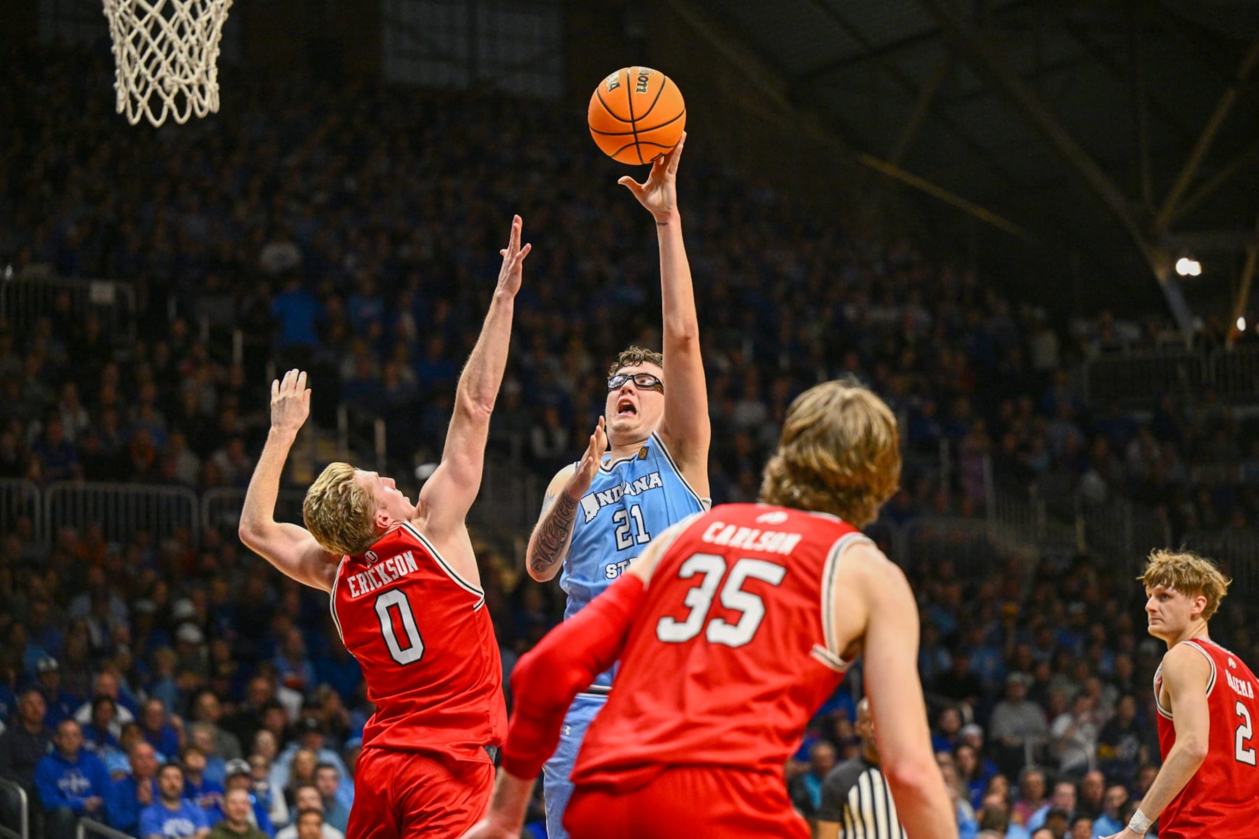 INDIANAPOLIS, INDIANA - APRIL 2: Robbie Avila #21 of the Indiana State Sycamores shoots against Hunter Erickson #0 of the Utah Utes during the first half of a NIT semifinals held at Hinkle Fieldhouse on April 2, 2024 in Indianapolis, Indiana. (Photo by Jamie Sabau/NCAA Photos via Getty Images)