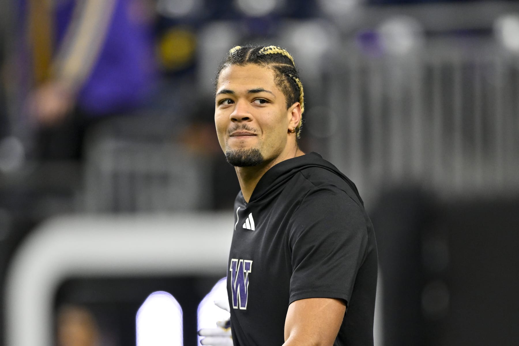 HOUSTON, TEXAS - JANUARY 08: Rome Odunze #1 of the Washington Huskies warms up before the 2024 CFP National Championship game against the Michigan Wolverines at NRG Stadium on January 08, 2024 in Houston, Texas. (Photo by Alika Jenner/Getty Images)