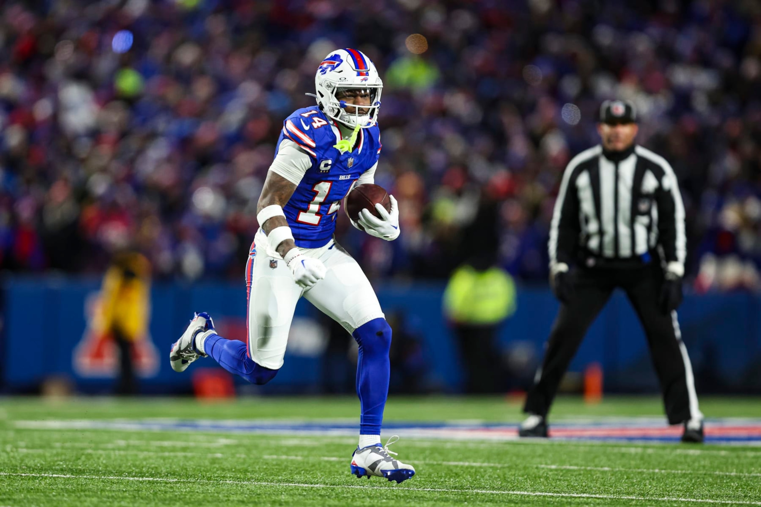 ORCHARD PARK, NY - JANUARY 21: Stefon Diggs #14 of the Buffalo Bills runs the ball during an NFL divisional round playoff football game against the Kansas City Chiefs at Highmark Stadium on January 21, 2024 in Orchard Park, New York. (Photo by Perry Knotts/Getty Images)