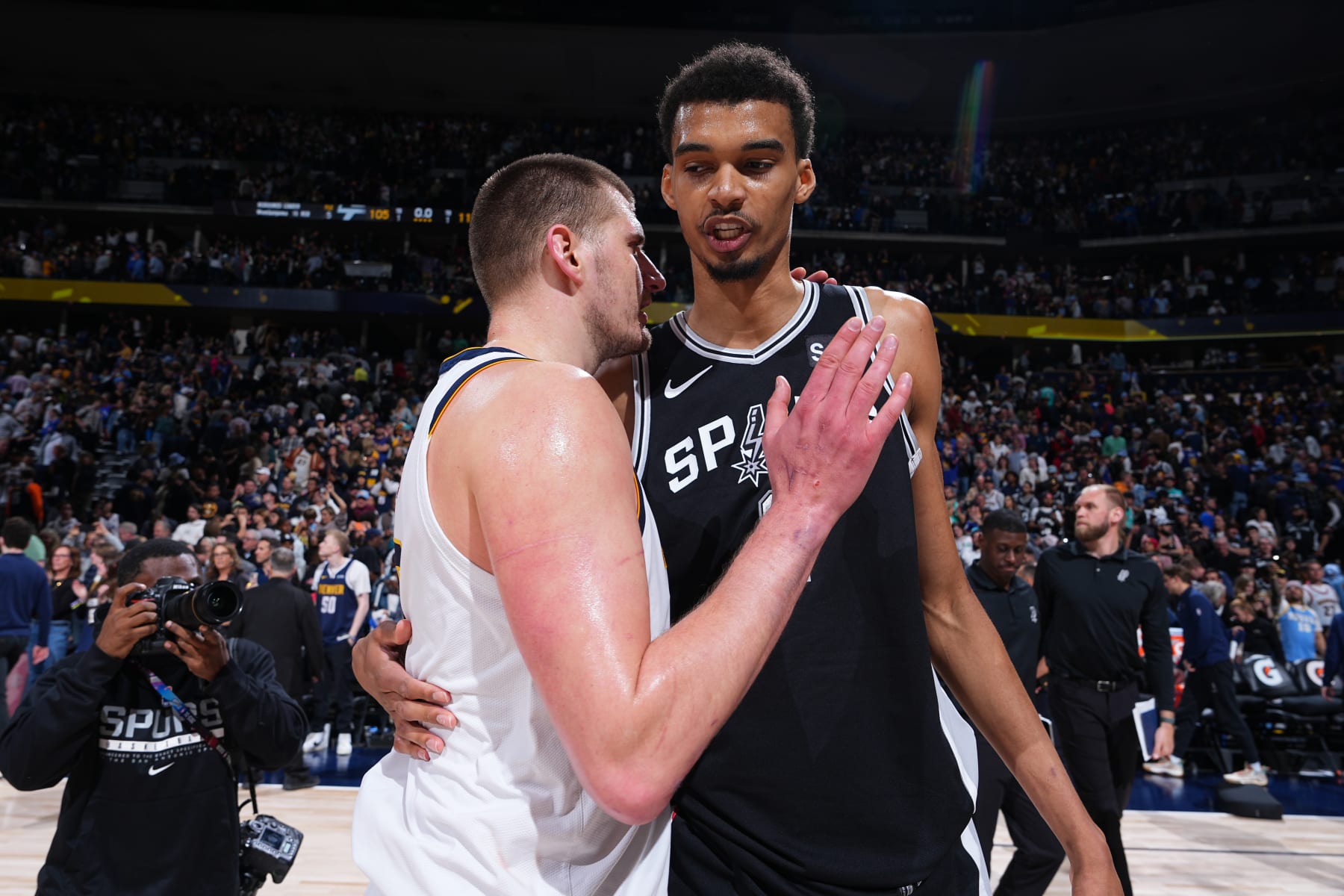 DENVER, CO - APRIL 2: Nikola Jokic #15 of the Denver Nuggets embraces Victor Wembanyama #1 of the San Antonio Spurs after the game on April 2, 2024 at the Ball Arena in Denver, Colorado. NOTE TO USER: User expressly acknowledges and agrees that, by downloading and/or using this Photograph, user is consenting to the terms and conditions of the Getty Images License Agreement. Mandatory Copyright Notice: Copyright 2024 NBAE (Photo by Garrett Ellwood/NBAE via Getty Images)