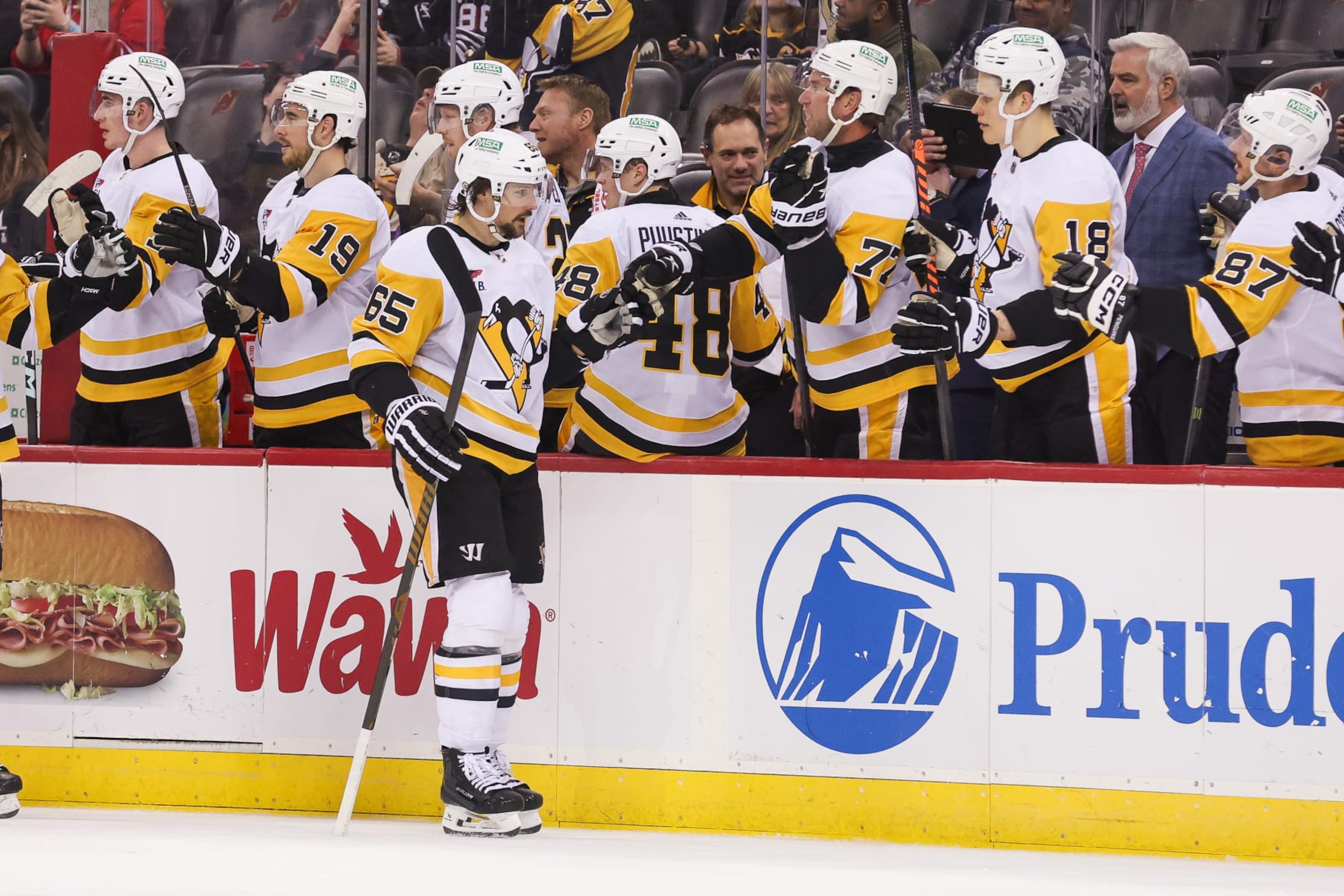 NEWARK, NJ - APRIL 02: Pittsburgh Penguins defenseman Erik Karlsson (65) celebrates after scoring a goal during a game between the Pittsburgh Penguins and New Jersey Devils on April 2, 2024 at Prudential Center in the Newark, New Jersey. (Photo by Andrew Mordzynski/Icon Sportswire via Getty Images)
