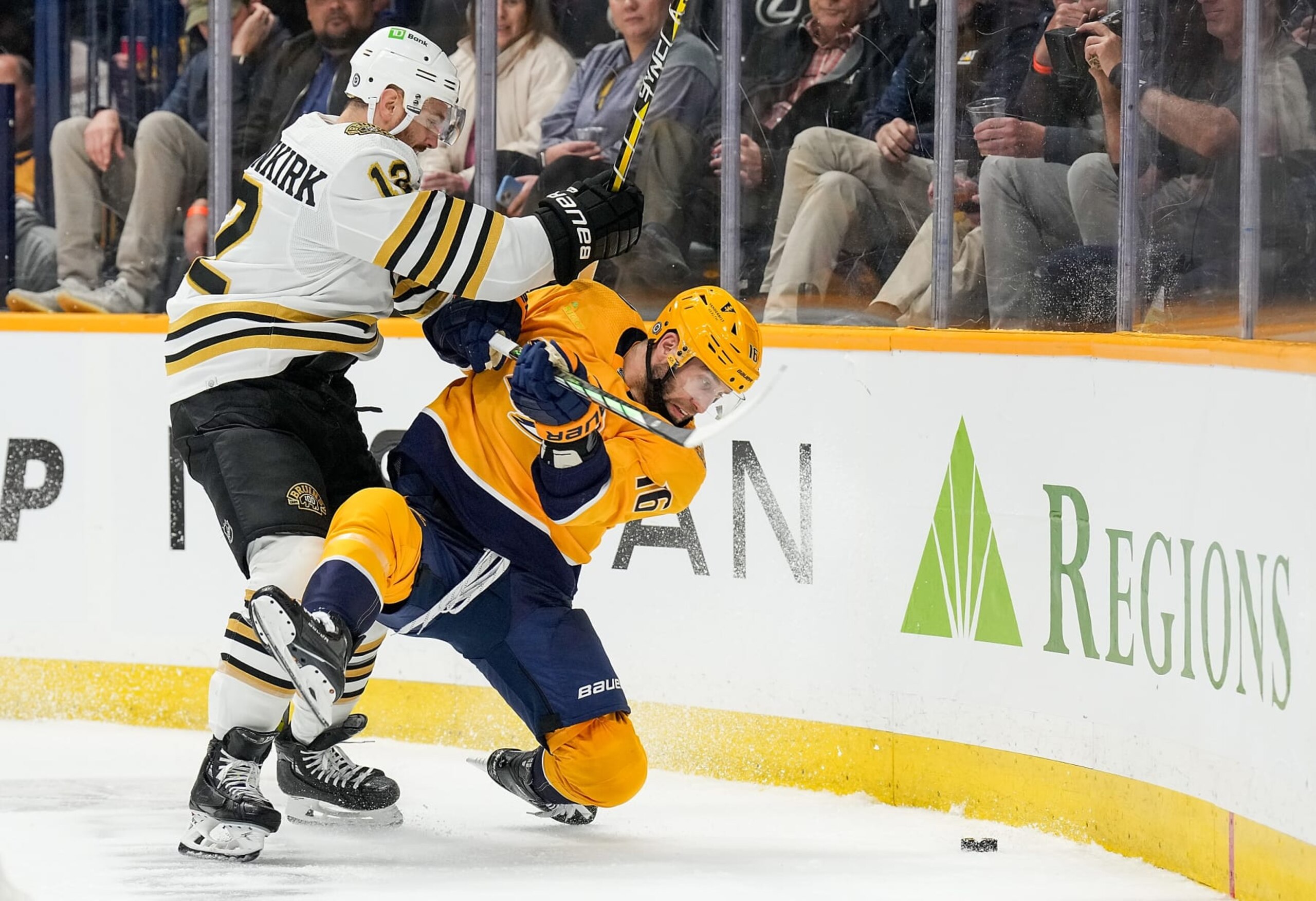 NASHVILLE, TENNESSEE - APRIL 2: Kevin Shattenkirk #12 of the Boston Bruins checks Jason Zucker #16 of the Nashville Predators during an NHL game at Bridgestone Arena on April 2, 2024 in Nashville, Tennessee. (Photo by John Russell/NHLI via Getty Images)