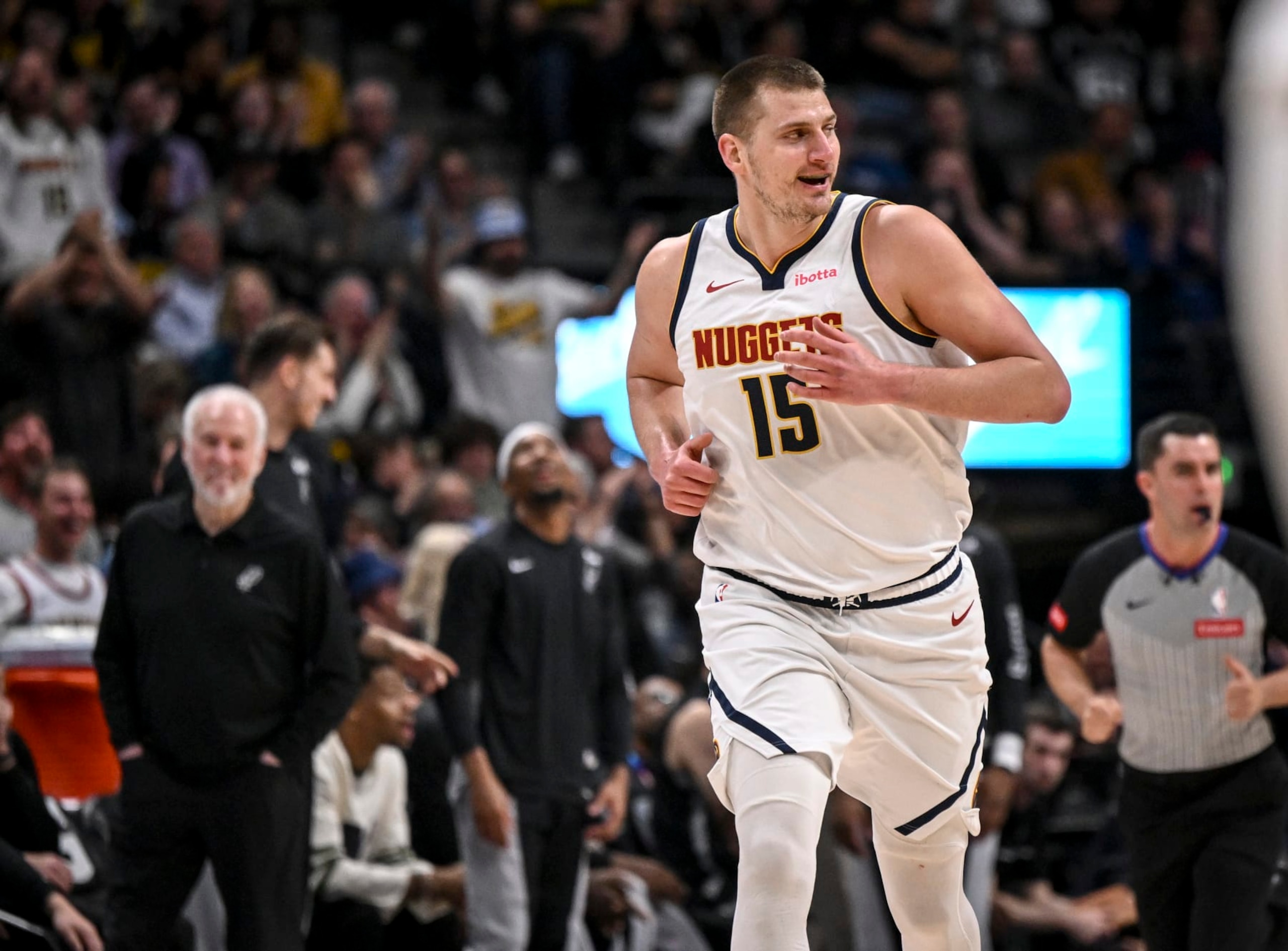 DENVER, CO - APRIL 2: Nikola Jokic (15) of the Denver Nuggets smiles in the direction of Victor Wembanyama (1) of the San Antonio Spurs after dunking on him during the first quarter at Ball Arena in Denver on Tuesday, April 2, 2024. (Photo by AAron Ontiveroz/The Denver Post) DENVER, CO - APRIL 2: Nikola Jokic (15) of the Denver Nuggets smiles in the direction of Victor Wembanyama (1) of the San Antonio Spurs after dunking on him during the first quarter at Ball Arena in Denver on Tuesday, April 2, 2024. (Photo by AAron Ontiveroz/The Denver Post)